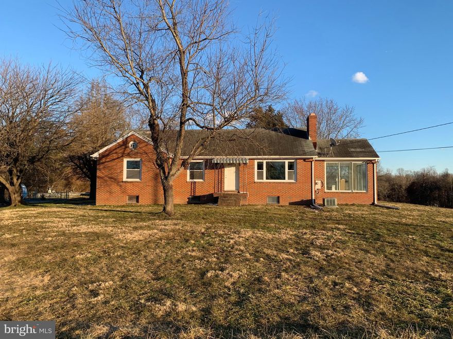 Listed and Sold simultaneously - 4.87 acres with tree buffer from the road.   The curved driveway leads you up to the brick rancher sitting high on the hill.   One level living with 3 bedrooms and a full bath on the main level plus a partially finished basement with full bath.    Open kitchen with island, cooktop and wall oven.   Light and bright sunroom addition and deck.  Wood burning fireplace with brick surround in the living room, newer furnace in 2021, refinished wood floors in 2021, fresh paint throughout the main level in 2021.   Feel like you are in the country but only minutes to major roads, shopping and restaurants.   There is an in-ground pool that is not in use and a parking pad which was a prior garage.   The house can be lived in or renovated.  So many possibilities with this acreage and location.  Note:  The property extends beyond the rear fence into the tree line behind.