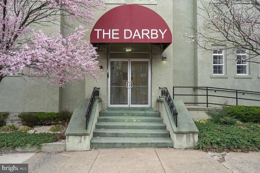 The Darby is a secured building with a fully gated parking lotRenovated and converted to condominiums in 2006, it features 27 residences across three floors with high ceilings, wide stairways, and oversized halls.

* Dining/living room combination and a full kitchen
* Stackable washer/dryer in-unit
* Primary bedroom with an attached ceramic tile full bath
* Its own heat pump and AC system for comfort and efficiency

Each condo has **one assigned parking spot** plus **one unassigned free spot** per unit. A convenient front entrance ramp brings you directly to the second-floor lobby, on the same level as this unit.

The **condo fee covers**: water/sewer, trash, snow removal, and common area management.