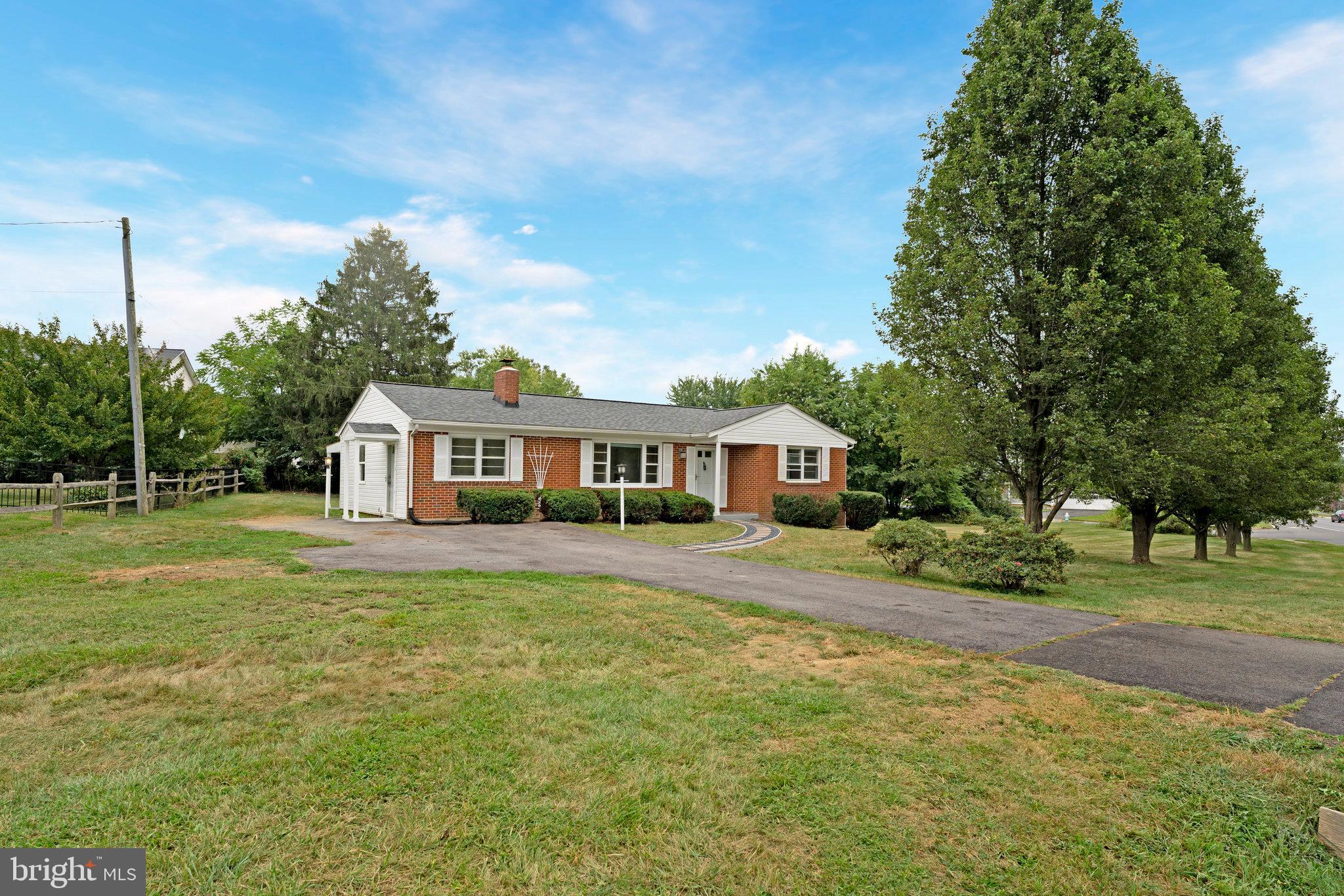 This charming all brick renovated rambler is just a few steps from the Lovettsville town center, the downtown, and minutes to the Town Green and Walker Pavilion. It is also located on the bypass connecting Virginia to Maryland and the Eastern Panhandle, making this a great location! Step inside to find a bright white kitchen, stainless appliances, fresh paint and new flooring thoughtfully refreshed to blend modern touches with classic character. Features include a wood burning fireplace, the ½ acre yard full of mature landscaping and a private covered back porch- which all invite you to relax and soak up the peaceful surroundings. There is a finished basement perfect for storage and additional living space. No HOA. This well maintained home won’t last long!