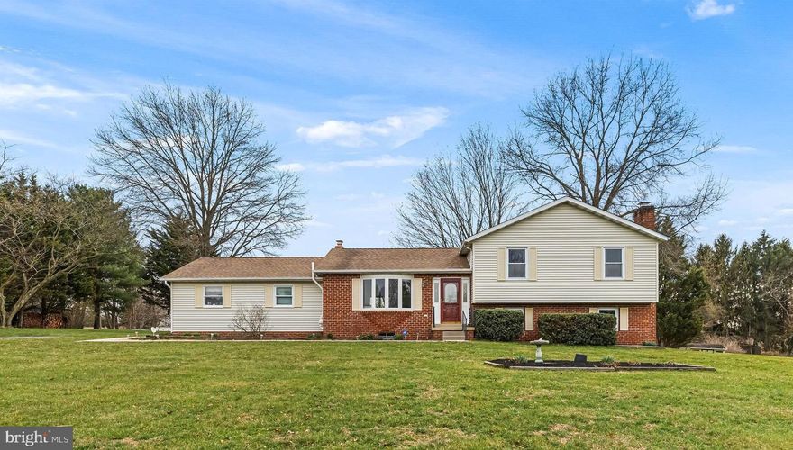 Nestled on a quiet cul-de-sac with easy access to I-83, this well-maintained split-level home presents an excellent opportunity in the sought-after Hereford Zone. The main level welcomes you with a bright, sun-filled living room that flows  into the formal dining area. Sliding glass doors open to a Trex deck with serene views of the private backyard. The kitchen offers ample cabinet space, updated appliances, and a dual stainless-steel sink. Upstairs, the primary suite features  skylights, double closets  and a private full bath. Two additional bedrooms and a second full bath complete the upper level. The lower level includes a cozy family room with a brick fireplace, a flexible home office area, a full bath with laundry, and walk-out access to the backyard through a second set of sliding doors.  Additional highlights include a spacious storage room with workshop potential and an attached two-car garage, offering ample space for organization and hobbies. Freshly painted throughout and new carpet installed. Conveniently located near Big Truck Farm Brewery and just minutes from dining, shopping, and major commuting routes, this home presents exceptional value and potential in a desirable location.