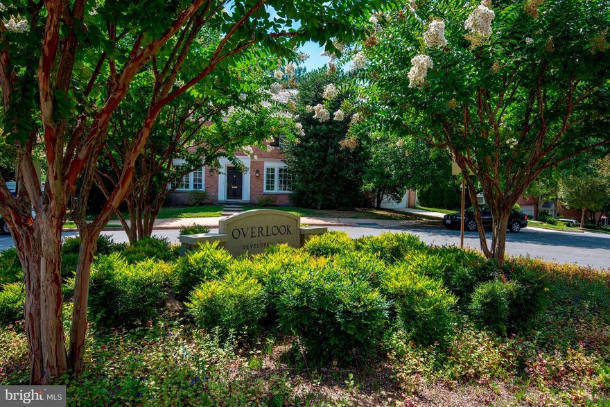 Not your traditional Overlook house--California style with floor to ceiling windows with fabulous reservoir and woodland views. Great entertaining spaces and 4 bedrooms plus 3.5 baths. The house is well maintained. The roof is four years old and the HVAC is one year old.  You get to do the fun stuff! Half a block from the neighborhood pool and playground--this house will be totally dreamy when you renovate the kitchen. Beautiful garden and a two car garage.