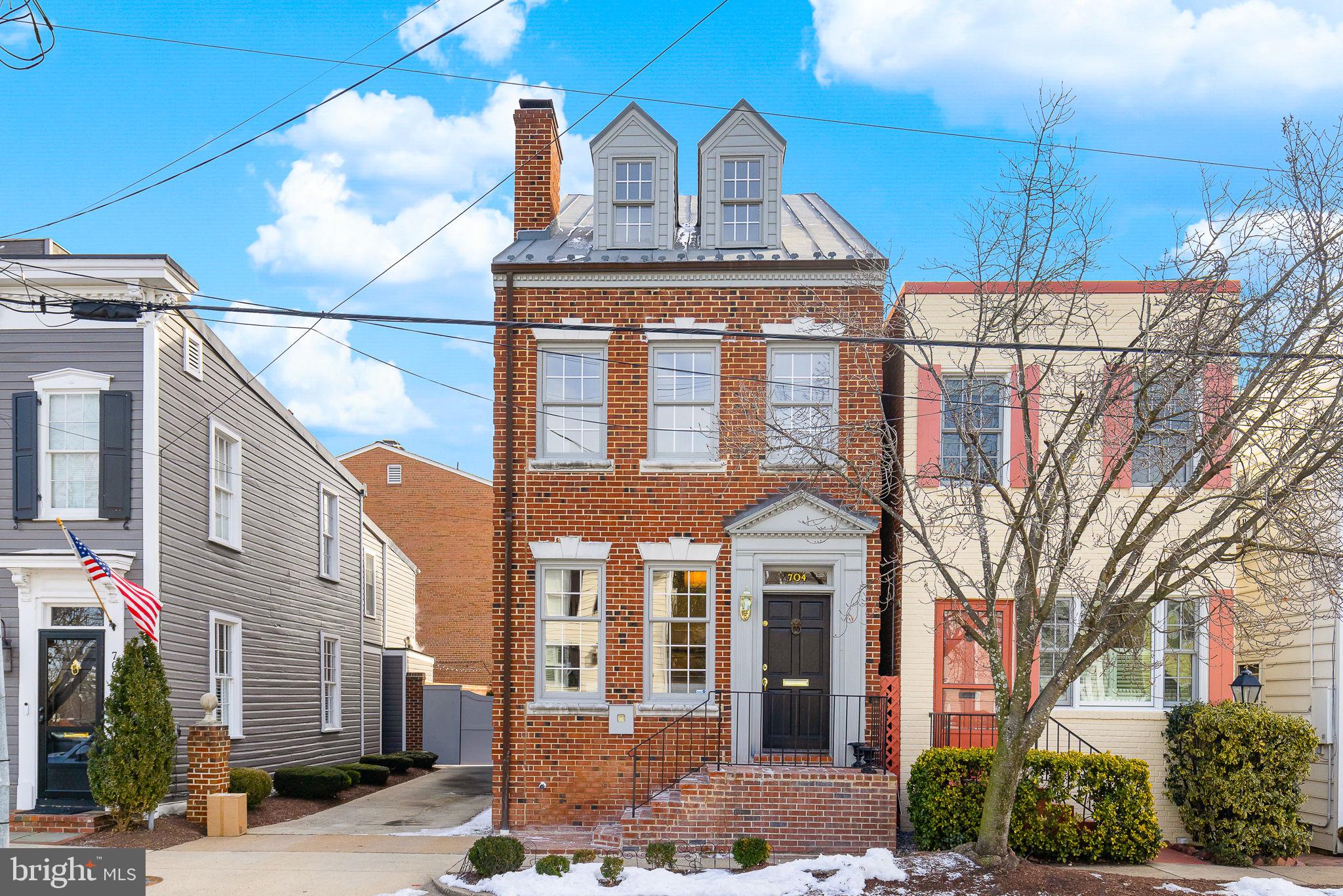 Old Town’s SW Quadrant - Townhouse on Rare Double Lot Offers Endless Possibilities!
This elegant 3BR/2.5BA brick townhouse sits on an exceptional oversized double lot (parcels 704 & 702-A) offering unique development potential. Beyond the historic charm and modern updates inside, the additional lot provides prime potential development such as a garage/carrriage house or an accessory dwelling unit (ADU), expanding both living and investment options (subject to restrictions).
The home itself is rich in character, featuring hardwood floors, large windows, and two wood-burning fireplaces. The inviting living room leads to a spacious formal dining room with built-ins, while the updated kitchen boasts granite countertops, stainless steel appliances, and French doors opening to an oversized private garden—ideal for entertaining or future expansion.
Upstairs, the primary suite includes a Juliet balcony, two large closets, and an ensuite bath, while the second bedroom features built-ins framing a cozy fireplace. A versatile loft level offers flexible space perfect for a third bedroom, home office, or bonus space. The lower level includes a generous laundry room with ample storage.
Currently configured with rare off-street parking for two vehicles, this property presents endless possibilities for expansion while maintaining its historic character. Located just blocks from Alexandria's waterfront, shops and restaurants. With easy access to King Street Metro, Reagan National Airport, Washington, DC, and major commuter routes, the location is perfect for commuters. This property is a standout for those looking to invest in Old Town’s charm — with the added benefit of future expansion potential.