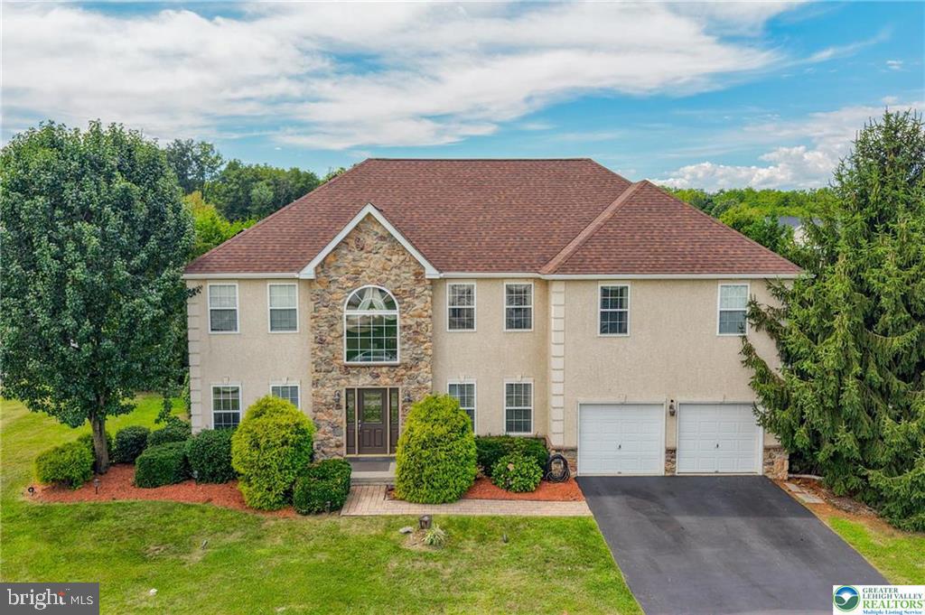 This stunning Parkland colonial offers an ideal combination of sophisticated design and eco-friendly features. This was the model home for Whispering Farms. With over 3,200 sq. ft. of living area (not including the lower level with already installed egress window), discover a soaring two story great room, huge eat in kitchen, and inviting sunroom. The garage is heated with AC. Not only does the home have true 3 zone HVAC, but the sellers added a solar system that dramatically reduces energy consumption. Consider: Gas average bill last 12 months- $96.77/ mo. PPL electric, 2024 average- $52.55! With a school bus stop just steps away, and a location that offers easy access to...everywhere...your choice is easy. Call today for your personal showing.