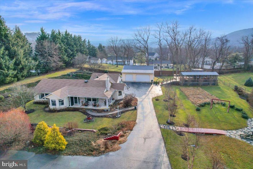 Well maintained 4 bedroom 3 bath ranch home in Carroll Valley on a 1+ acre lot. Home was custom built to be handicap accessible, featuring 3' doorways and wider hallways. This home features a separated living area that could be used as an in-law suite.  A separate entrance leads to a bedroom, full bath, kitchenette, and living area. This home has a roof less than 5 years old as well as a brand new HVAC  installed in 2024. An oversized 3 car garage , 2 outbuildings, and a 40' x 32' composite deck with enclosed cabana makes this property ideal for those who enjoy the outdoors. Beautiful thought out and well maintained landscaping make this property stand out in the neighborhood. Only minutes from Carroll Valley Resort with golf and skiing and only 10 minutes from the MD line and route 15 add to the appeal of this location. Schedule your showing today and make 3 Spur Trail your new Carroll Valley address!