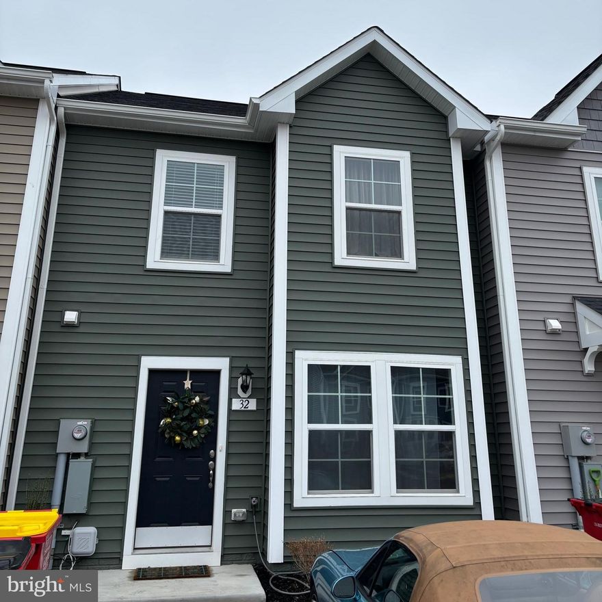 Welcome home to this beautiful new two story town home in Whispering Pines. Upon entering take in the open and inviting floor plan with LVP flooring and large living room. The kitchen is well appointed with quartz countertops, large island perfect for cooking and other projects. All stainless steal appliances and large pantry. There is room for a table in the kitchen as well. The bump-out adds additional living space for larger table or second family room. The sliding glass doors open to a nice flat yard. Upstairs, the primary bedroom also has the bump-out which makes it a grand suite with additional windows, and a usable space for a sitting area. The room easily accommodates a king size bed with additional space for dresser and end tables. There is a large walk-in closet and the en-suite bathroom has double sinks and stand up shower with bench. The two additional large bedrooms are down the hall and share a hall bath with a tub. The laundry with brand new washer and dryer are also on the bedroom level. The Whispering Pines community is perfectly located close to Martinsburg, Winchester, and Charles Town as well as near commuting routes on 81 and Route 7. A perfect place to call home!