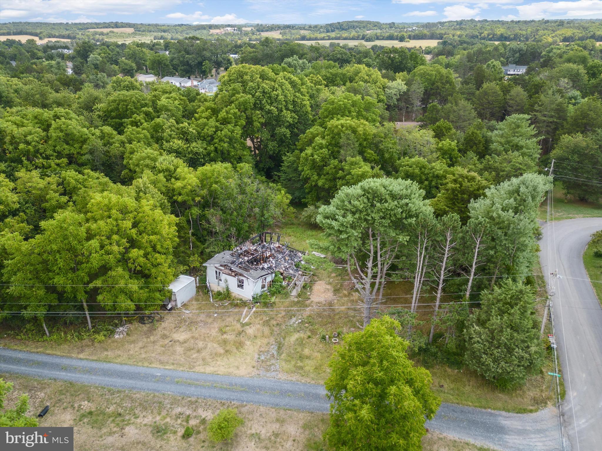 Build your dream home on this 1.14 acre, partly wooded (with mature trees), corner lot in the established neighborhood of Hidden River close to the Opequon Creek. The existing home burned down earlier this year and will require the buyer to remove what’s left of the home. Well and 3 bedroom septic are still in place. No HOA! Call today to schedule your showing!