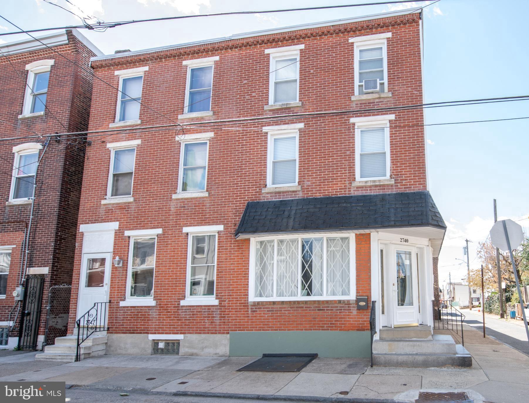 Welcome to 2740 Pratt Street located in the heart of Bridesburg.
This five-bedroom, one and a half-bath end-of-row home sits on a corner lot with classic brick-front charm. As you step inside the home, you're welcomed into a bright family room with a decorative fireplace that then flows into a spacious living room. An eat-in kitchen featuring abundant cabinet space and room for dining is also located on the first floor. An entrance-exit door from the kitchen leads to the outside and just a few steps away to an outside bathroom and also a side access to the garage. (Please note: this outside bathroom on listing is listed as the half bath on main level) Upstairs, the second-floor hosts three well-sized bedrooms, a bonus room which offers flexibility- ideal for a home office, nursery, or additional storage and there is also a full hall bath with tub/shower. The third level features a large primary bedroom, offering privacy and a quiet retreat and one additional smaller bedroom ideal for a nursery on the same floor as the primary bedroom.
(5 bedrooms plus bonus room in all) The unfinished basement is where you will find the laundry area featuring a washer and dryer and a bonus shower area. (behind the curtain) There is a detached one-car garage that features a walk-up loft and workshop area adding value - great for hobbyists or extra storage. While the home does need some updating, the layout, square footage, and the unique features make it a great opportunity in this neighborhood. Close to schools, shopping, I-95, and public transportation. Schedule your appointment today to take a look.