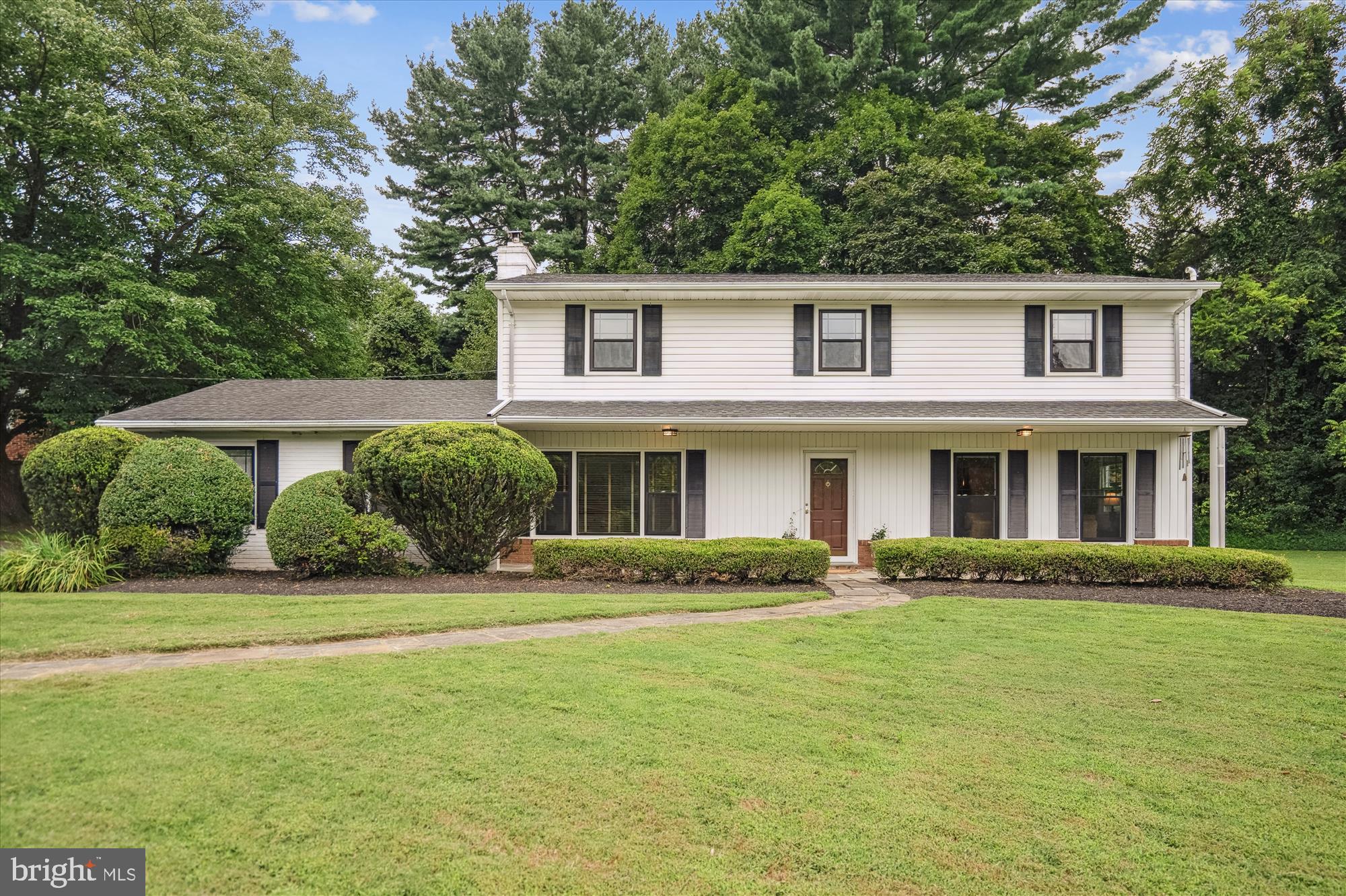 Open Sunday 8/24 from 1-3! Welcome to 17724 Tree Lawn Drive! A rare opportunity to own this classic colonial home in the peaceful neighborhood of Sam Rice Manor. This lovingly cared for home sits on a .70 acre corner lot lined by beautiful Kwanzan flowering cherry trees. Step inside to discover over 3,000 square feet of inviting living space across three levels. Main level has gorgeous solid hardwood floors and a formal living room opening to the formal dining room. Tablespace kitchen has new ceramic tile flooring, gas cooking and plenty of cabinets custom made by Watkins cabinet company with pull out drawers. Family room which includes a Vermont Castings woodstove and large picture window leads to the laundry/mud room and powder room with new ceramic tile. Back door opens to a cozy patio surrounded by flower beds as well as a side load carport with space for two cars plus more in driveway. The upper level also has solid hardwood floors, all new 6 panel doors and four large bedrooms, including an ensuite primary bedroom with two closets. One is a walk-in closet and a smart layout - shower and toilet are tucked behind a separate door providing added privacy. 2nd full bath off hallway has large soaking tub and double sink vanity. The unfinished lower level has walk up stairs and a large window. It is clean and dry and can be easily converted to add extra living space. There is also a 10 x 12' Amish built shed in back yard for extra storage space. This home has new replacement windows and doors, new HVAC, new hot water heater and a 1,000 gallon propane tank buried in back yard that is owned. Whether you are enjoying your morning coffee on the patio or hosting a summer gathering, the peaceful setting makes every moment feel special. Located just minutes from downtown Olney, local parks, top-rated schools and easy access to the ICC for easy commuting to 270 or 95. Experience the best of rural charm and fall in love with Ashton living!