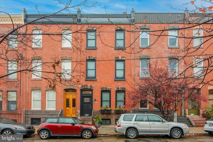 Welcome home to this stunning 5-bedroom, 3.5-bathroom residence that has been meticulously renovated, offering a perfect blend of historic charm and modern amenities in the heart of Fairmount.  Complete with a roof deck providing breathtaking views, and a fully finished basement, this home is the urban oasis you have been looking for. As you enter the front door, you'll be greeted by the beautifully restored original wall tile with complimentary penny floor tile, and updated banister with original moldings. The spacious living room features solid hardwood floors that flow through the rest of the home, and large windows that allow an abundance of natural light to fill the space. A cozy gas fireplace adds warmth and character, creating the perfect atmosphere for relaxation.  The gourmet kitchen is a chef's delight, boasting high-end black stainless steel appliances, quartz countertops, and custom cabinetry. The oversized island makes it an ideal space for entertaining, and the walk-in pantry provides more than enough kitchen storage. The first floor is complete with a convenient half-bath and front coat closet. Downstairs, the fully finished basement provides an additional flex living space and a storage area that could also serve as a home workshop. Upstairs, the five well-appointed bedrooms provide ample space for a growing family or the flexibility to create a home office or fitness room. The luxurious bathrooms feature modern fixtures and elegant finishes. The primary suite on the third floor has ample space for a king bed and seating area, a spacious walk through closet and charming primary bath with stand-up shower. Step outside onto the roof deck, where you'll be captivated by panoramic views of Philadelphia. This private outdoor space is an ideal spot for morning coffee, evening cocktails, or entertaining guests while enjoying the city lights. Additional features of this exceptional home include updated plumbing, HVAC, windows, insulation, electrical system, and a dedicated laundry room on the second floor. The property is conveniently located near Fairmount Park, museums, dining, shopping and public transportation.  Sellers also have a transferable overnight parking spot at the school across the street. Don't miss the opportunity to make this renovated gem your new home. Schedule a showing and experience the perfect blend of historic charm and modern luxury in the heart of Fairmount!