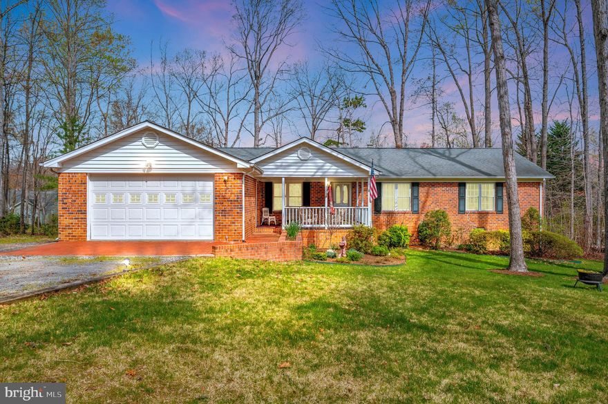 Unusual to find brick rambler with all of the typical living rooms & spill-over spaces. Located in a section of the neighborhood with a popular beach overlooking the main lake - Cornwallis Beach. Sitting back off the street provides more privacy. Greet your neighbor from the covered front porch sitting area as they walk these quiet interwoven streets.  Natural lite is added into the dining, fam rm & one guest bedroom via solatubesAn unusual feature of the dining room is the wood surround inlay carpet.  The kitchen offers eat-in table space plus a handy breakfast bar counter. There is hang -up space & cabinetry in the laundry room which also has a door to the rear deck. The primary bedroom is behind the garage. The guest wing is on the other side of the family room. The oversize garage enters the home via the covered front porch. Both the screen porch & BBQ deck (gas line hookup to grill)  overlook a lawn backyard with minimal landscape & gardening beds. Seller is open to negotiating a decorator allowance!!