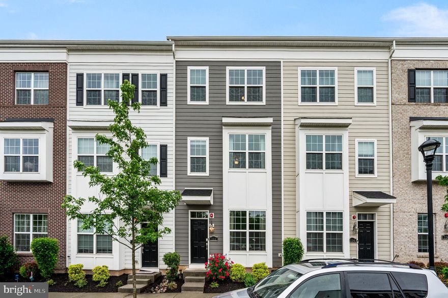 Tucked into one of Waterside's quiet open-space-facing locations and just steps from the river, this 3-bedroom, 3.5-bath townhome offers more than 1,900 square feet of light, two private balconies, and a layout that has been thoughtfully upgraded. The original loft was enclosed to create a true second primary suite with its own full bath—so the home now offers two ensuite bedrooms, plus a third bedroom served by a full hall bath. Built recently and meticulously cared for, it shows like new throughout. Outside the door, the community's walking paths wind along the waterfront to a tot lot and a much-loved on-site café. The HOA handles lawn care, snow removal, trash, and common areas, leaving weekends free. Pristine condition, two ensuites, two balconies, and one of the better vantage points in the neighborhood. Please note, some photos are virtually staged.