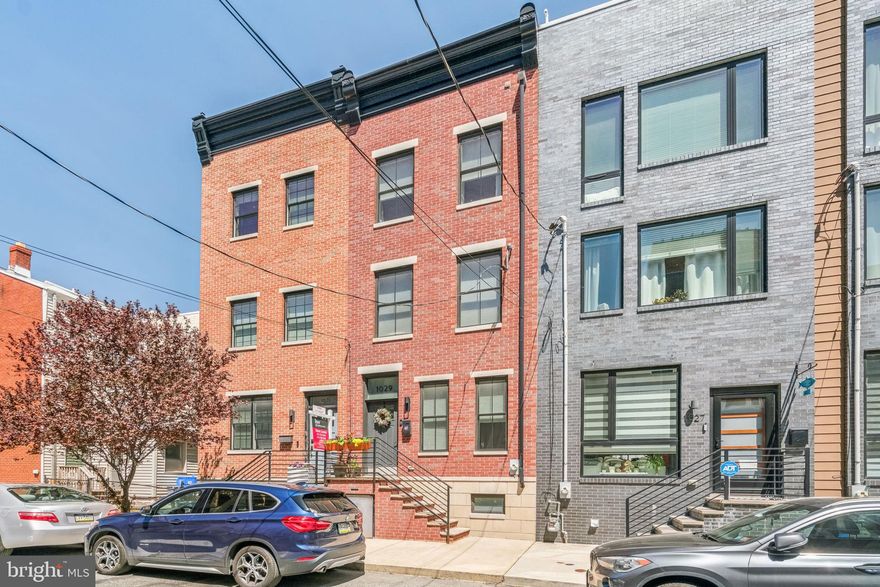 Located in the highly sought-after ADAIR Elementary K–8 catchment, welcome to Earl Street—a quiet, less-traveled block with Resident Permit Parking. Experience true neighborhood living in the heart of Fishtown. This close-knit block stays connected through its own Facebook group and participates in the Glitter Program, dedicated to keeping the street clean and beautifully maintained. Don’t miss this gem, including a One-Year Tax Abatement.
This handsome home seamlessly blends old-world charm with modern design. From the designer kitchen to three inviting outdoor spaces—including a stunning ROOF DECK—every detail has been thoughtfully curated.
Step inside to discover solid craftsmanship throughout, highlighted by extra-wide hand-scraped hardwood floors. The first floor features an open-concept living space, a convenient half bath, and a beautifully designed kitchen with gas range, farmhouse sink, dishwasher, and glass doors leading to a rear patio—perfect for grilling.
The second floor offers two spacious bedrooms with generous closets, a full bathroom featuring quartzite countertops, subway tile, and built-in shelving, plus a large private BALCONY.
The third floor is dedicated to the primary suite, complete with two large closets and a stylish ensuite bath featuring a double vanity, upgraded tile, and an extra-tall glass shower.
Unwind on the expansive ROOFTOP DECK—no backyard bugs, just fresh air and sweeping cityscape views.
The finished basement provides a versatile, contemporary space ideal for a family room or playroom, along with a full bathroom—perfect for guests.
This home has been pre-inspected by Pillar To Post and is truly market-ready. A copy of the inspection report is available, offering transparency and peace of mind.
Move right in and enjoy everything this exceptional home and vibrant community have to offer.