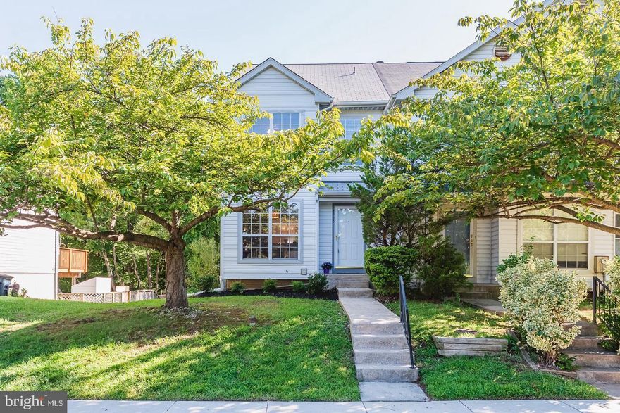 This beautifully updated end unit features an open-concept layout. Enjoy the convenience of a bathroom on each floor! The kitchen is bright with natural light and includes a pass-through window to the dining area. The living room opens to a deck overlooking a fenced yard with a wooded backdrop. The upper-level full bath offers dual entry. The spacious bedroom closets provide ample storage. The finished lower-level family room boasts a wood fireplace with space for a workout or play area, a half bath, and a storage room. Walk-out sliders lead to the fenced yard. Additional storage includes shelving and a cedar-lined closet in the laundry room. Recent updates include water heater (2024), a newer HVAC system (2018), washer/dryer (2019), refrigerator (2018), and dishwasher (2016). The  fence has been recently redone and stained, and the roof is approximately 10 years old. A community pool is available for an additional fee. Conveniently located near I-95, Route 40, and APG -  this won't last long!