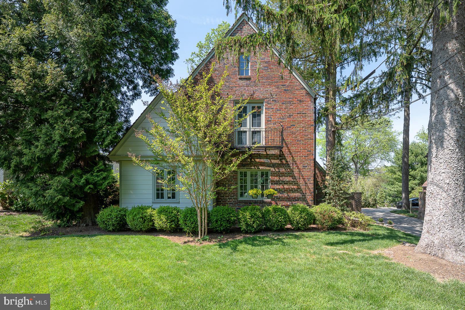 Welcome to 30 Deepdale Road!!
Take advantage of this rare opportunity to purchase an English style brick Tudor that artfully combines old world charm with modern amenities. If you have been seeking a truly SPECIAL home, look no further!! Located within the award winning T/E school district, and only a short distance from the Strafford Train Station, Farmer’s Market and the town of Wayne!
Enter through the arched front door of this idyllic home and step into gracious living!!
Down a few steps, the inviting living room incorporates the warmth of a gas fireplace, custom millwork and built in bookcase creating the perfect atmosphere to curl up with a good book. Pass through beautiful French doors as you enter the updated (2018) kitchen which boasts 42" white cabinetry, a spacious island with abundant storage and quartz countertops, Monogram Profile Series stainless appliances, a wine refrigerator and hardwood flooring. The kitchen and living room flow seamlessly into the stylish dining room with beamed ceiling and a white washed brick wall. Beyond the Kitchen is a well appointed Butler’s Pantry (also renovated in 2018) with built in cabinetry, custom wood counter tops, 'brick look' tile flooring, and a writing desk. Finishing off this space is a bench/cubby area with four built in coat hooks as well as a powder room with pedestal sink. As you make your way through the back door, you are greeted by a magical private garden- complete with flower/herb stone lined garden areas, a fully fenced yard, large slate patio and a grassed play area perfect for entertaining. Completing the lower level is an attached two car garage. The shared driveway allows for off street parking of two cars outside of the garage of each home.
Upstairs, the primary bedroom is made complete with a huge walk in Designer Closet, oak hardwood flooring, crown molding and atrium doors to a lovely balcony. The primary bath (renovated in 2020) is enhanced by radiant heated flooring, huge quartz (Chipped Ice) double sink vanity, Vallelungo Italian tile flooring, large glass enclosed tile shower and vaulted ceiling. Contained within the primary closet are a large vault and a secret door which opens to a third floor attic for additional storage as well as a large cedar closet ideal for off season clothing. Finishing off the main upper level are two additional bedrooms and an updated full bath with artisan tilework on floor, walls and vanity as well as a large glass enclosed tub/shower.
From the butler's pantry there is a back staircase leading to the fourth bedroom which would be ideal as an au pair or in-law suite. It features hardwood flooring, updated windows and plantation shutters. The attached private bath has tile flooring, a full glass shower and lovely vanity with a blue glass sink.
On the lower level, the basement contains a carpeted workout room with mirrored walls, (extra motivation!) the laundry room which has built in cabinets and shelving, a tiled second powder room and a storage room.
The lucky new owners of this home will delight in all that it has to offer...proximity to SEPTA regional rail (offering easy access to Philadelphia), Route 30, 202 and the turnpike, wonderful shopping and dining in Wayne and King of Prussia and award winning T/E schools, and the honor of calling this one of a kind treasure HOME!