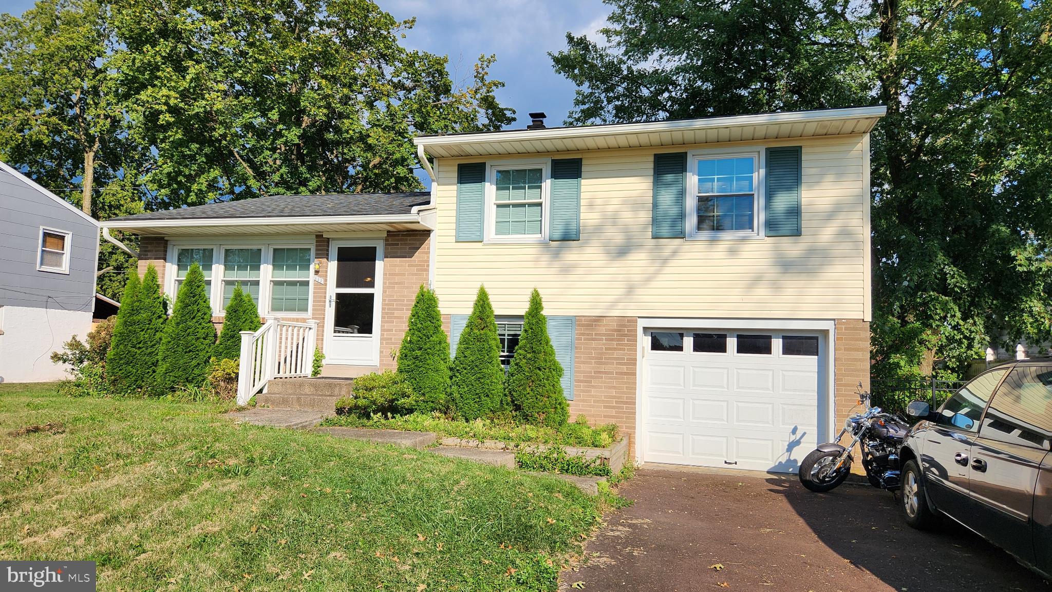 Nestled in the well-regarded Amity Gardens subdivision of Douglassville, this charming 3-bedroom, 1.5-bathroom split-level colonial offers both character and modern comfort. Recent improvements include a newer roof, garage door, updated kitchen cabinets and appliances.
Inside, the main level welcomes you with a layout featuring a generous living room, dining area, and an eat-in kitchen. Upstairs, you'll find well-appointed bedrooms, while the lower level includes a partially finished basement with space for a potential home office or family room. The private, fenced backyard with a deck is ideal for relaxing or entertaining.
Conveniently located near parks, shopping, dining, and commuter routes, the home offers a perfect blend of suburban tranquility within the sought-after Amity Gardens neighborhood. Easy access to super markets, bowling, 422 corridor. Don’t miss your chance to call this home your own.