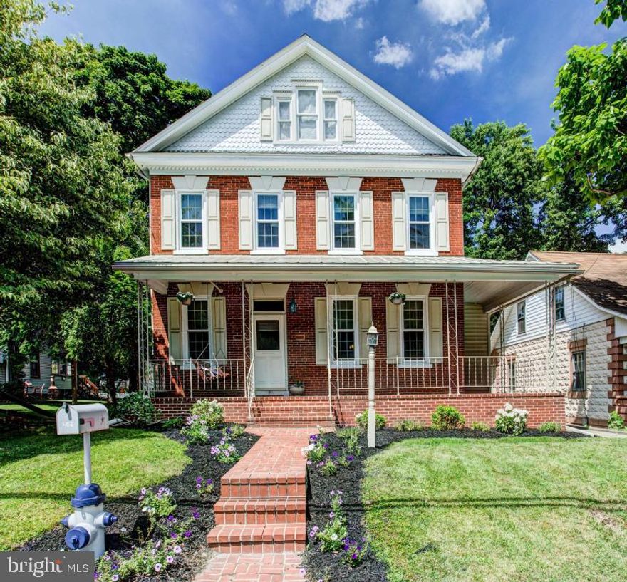 Do you love small town living?  Then you will love this beautifully done 1900's home with wrap around porch.  4 Bedrooms, 2 full baths, breezy rear covered porch w/ deck overlooking a lovely rear yard with garden.  New roof - plumbing, updated bathrooms - new windows - new back walkway - freshly painted exterior.