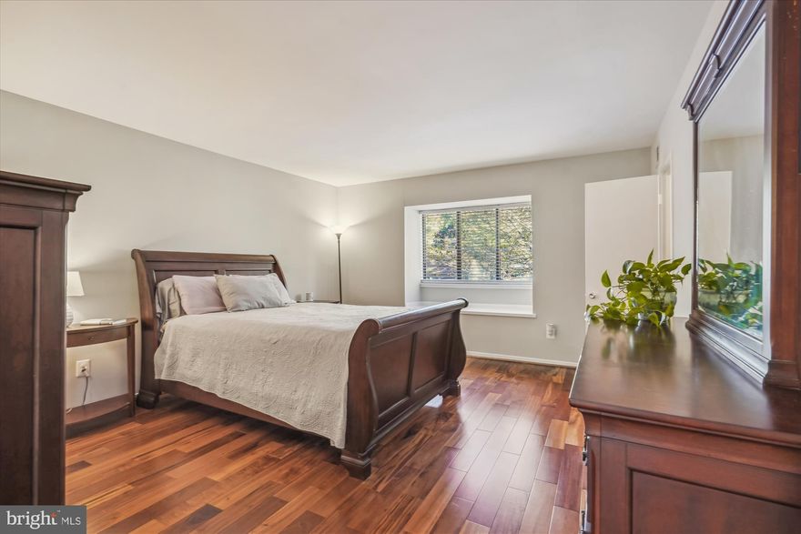 Welcome home to a nicely updated and well-maintained BIG one bedroom condo with a fabulous setting and  a location close to everything Reston living offers!  You'll love the beautiful wood floors and neutral décor, and the quiet and private setting out back!  Note the size - 949 Sq. Ft of freshly painted and refreshed space to enjoy!  The spacious kitchen offers brand new quartz countertops, stainless steel appliances, space for a table or island, and a bonus bay window because you're in the end unit!   The Dining Room also has an extra window on the side, and is currently being enjoyed as a wonderful Home Office.  The Bedroom is big enough to hold a King bed and all the furniture you can possibly need, and you'll have a Walk-in closet too!  The bathroom has just been refreshed with new grout and caulking in the floor and shower -- it feels like new! And you won't have to worry about anything!!!  All utilities (except phone and internet) are included in the condo fees, and the systems are all recent!  The Electric Panel and the range hood are brand new (9/23); the HVAC was replaced in 2017;  The stove (GAS cooking) and Dishwasher are only 1 year old; the Refrigerator is 5 ; and the Washer/Dryer set was replaced last May!  Don't miss the Carport right out front for fabulous convenience!  All of this within walking distance to conveniences, pools, 55 miles of Reston trails, near one of the biggest and best Farmer's Markets around, not to mention minutes to a Metro stop!  Your search for a great home can stop right here!  Don't wait - we'll be Open on both Saturday and Sunday, October 7th and 8th!!!