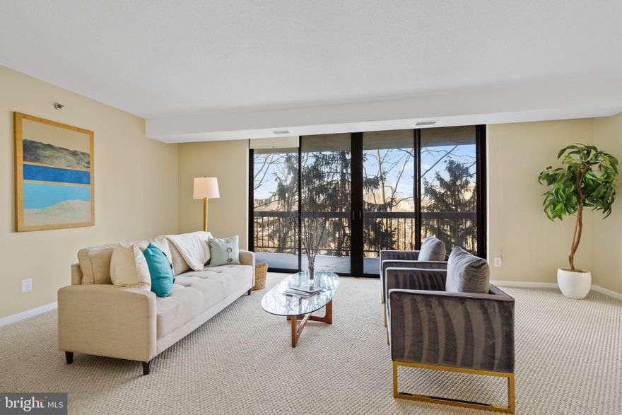 Welcome to this spacious corner unit, where your eyes will be immediately drawn to the tranquil evergreen views! The spacious balcony (19x7) with green views is an outstanding feature of this unit making it a standout! This unit has over 1500 sq. ft. of bright living space, an inviting hardwood foyer and floor-to-ceiling windows. With unobstructive views, natural light pours into every room, highlighting the open concept living and dining areas, ideal for easy living and entertaining.
The generous closet space in this unit is truly exceptional, rivaling that of many detached homes. With over 7 generous closets including 2 large walk-ins and a spacious kitchen pantry, you’ll have plenty of room for all your belongings. The kitchen features stainless steel appliances (refrigerator, 2024), a large pantry, and space for a cozy kitchen table, making it perfect for casual dining. The two bedrooms are both roomy, with new carpeting in the primary bedroom. 
A convenient separate laundry room adds extra functionality, and this unit includes one secure garage parking space. Building amenities include a pool, extra storage, a fitness room, sauna, party room, and library. Recently adjusted in price, this unit offers incredible value in a vibrant and walkable neighborhood, just steps from restaurants, shops, and grocery stores along Columbia Pike. Commuters will appreciate the easy access to I-395, the Pentagon, metro, and bus routes.
This is the one you’ve been waiting for—schedule a tour today!