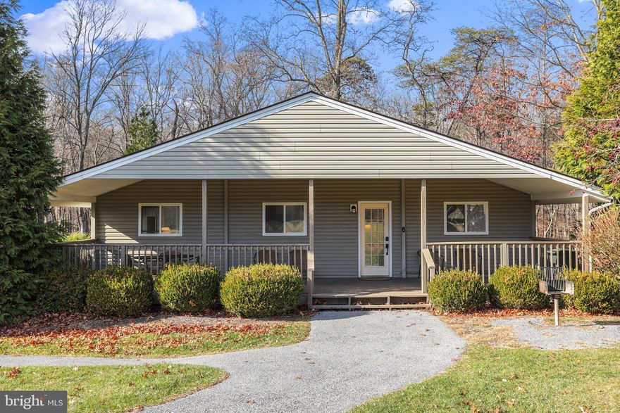 MOTIVATED SELLERS! Unwind in style: a home across from The Woods Sports Center awaits your active lifestyle! Boasting an established track record as a sought-after short-term rental, this property showcases a high occupancy rate during the bustling months of November and December. Step inside to discover an inviting open floor plan, highlighted by soaring ceilings and an abundance of natural light that fills the space, creating a warm and welcoming ambiance. The residence features four generously sized bedrooms, each complemented by its own private bathroom. Meticulously renovated in 2016, this home exudes modern charm, with recent updates including brand new LVP flooring in November 2023, three water heaters, and tons of storage space. Indulge in outdoor living on the full-length front porch, a perfect spot to unwind and savor the serene surroundings. The expansive side and front yards offer ample space for various outdoor activities, complemented by easy-to-maintain landscaping and a charcoal grill, promising delightful gatherings and delicious meals to come! Conveniently located across from The Woods Sports Center, residents can take advantage of a wealth of amenities, including indoor and outdoor pools, a hot tub, tennis, and pickleball courts, a gym, a library, and access to the serene lake—an extraordinary lifestyle at your doorstep. This home is being sold fully furnished, allowing you to pack your bags and move right in as you start your next adventure. Both sellers are licensed real estate agents.