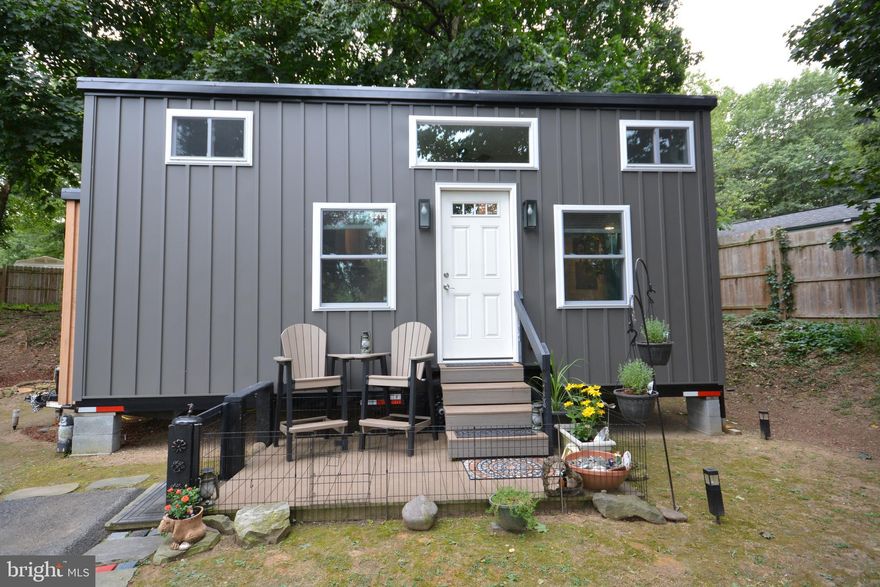 Looking for the perfect Tiny House retreat? This 2022 model by Liberation Tiny Homes offers modern comfort in the peaceful, gated community Tiny Estates in Elizabethtown, PA. Tucked away at the rear of the grounds and surrounded by trees, it’s the ideal spot for privacy and seclusion. Inside, every detail has been thoughtfully customized—from the KT Highland kitchen with gas stove and refrigerator to the stunning walk-in shower you’ll love coming home to. Cozy living and dining space on the main level creates an inviting atmosphere, while the lofted bedroom above makes the most of the home’s efficient design. Pine siding brings warmth and character, and the outdoor deck is perfect for morning coffee or quiet evenings under the trees. With lot rent of just $725 per month, including water, sewer, electric, propane, internet, and trash, you’ll enjoy affordable, low-maintenance living in a truly unique setting.