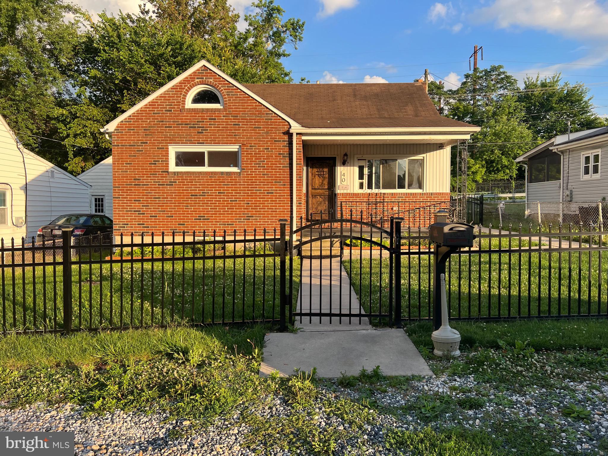 GREAT INVESTMENT! 3 LEVELS! Great home - needs some work, Lovely Brick Cape Cod with super nice covered front porch, Beautiful Front door & Fencing!! Landscaped with beautiful flowers.... great curb appeal. 2 bedrooms on main level & updated full bath, Really nice updated kitchen with appliances & vinyl flooring, Upper level could be used as 2 bedrooms or 1 bedroom and office, lower level great room with wood stove & full updated bath. Great big level backyard & fenced with shed. Lots of potential ! Being sold as is