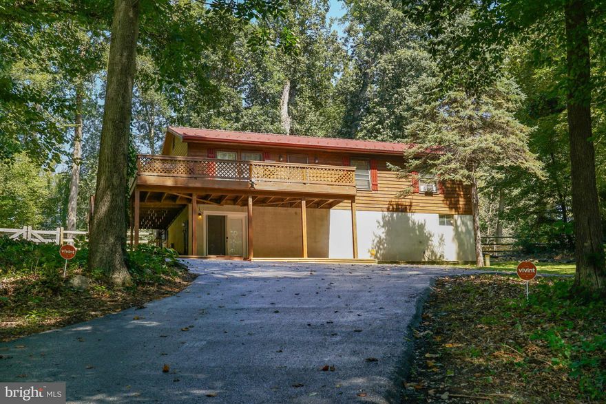 Schedule to see this meticulously maintained Raised 3BR, 2BA Ranch with timeless Cedar siding in highly sought after Octoraro Lakes! Fully cleared and fenced beautifully manicured lot (fence 3 years old). Preferring the Kitchen entrance, head to the rear deck (10 y.o.) through the new insulated French doors with built in blinds (2025) to enter your eat-in kitchen/dining area with counter bar, stainless ceiling fans, and upgraded vinyl plank flooring (4 y.o.). Relax in the front living room with upgraded vinyl flooring (2 y.o.) or exit onto your wrap-around deck ( 10 y.o.) with woodsy high-top view, for more of nature's enjoyment or entertaining with friends! The Primary bedroom has an en-suite full bath completely updated (2025) and plenty of closet space. Additional 2 bedrooms are both spacious with generously accommodating closets. Beautiful Hall full bath was completely renovated (2025). The ground floor enters into your fully finished Great Room with center access to the main floor. You have a separate storage/workshop area and laundry area with your Pellet stove; which has been the owners sole choice for heating the entire home! Ductless Mini split A/C ( 2 y.o.) in center Kitchen area keeps the living space cool with window units used in Bedrooms, IF needed. Vivant security system throughout home. New Roof with gutters/gutter guards (2024). Driveway sealed 2025 (fully repaved 3 y.o.). 24 X 24 detached 2-car garage ( 4 y.o.) in excellent condition with 2 parking spaces. Boat storage - you're all set! You'll have the lake, the picnic area, the wooded scenery throughout. Enjoy a home that lets you enjoy Octoraro Lakes! Schedule your tour today!!