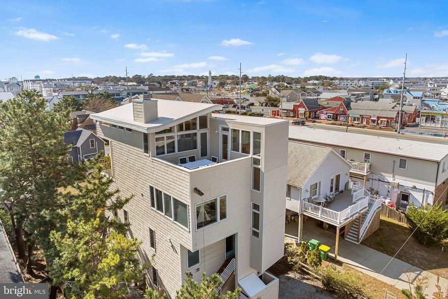 The Iconic “Shiphouse” – A Fenwick Island Landmark

A true Fenwick Island icon, the “Shiphouse” stands as a one-of-a-kind architectural treasure—featured in Architectural Magazine for its distinctive coastal design.
The ground level offers a self-contained 2-bedroom, 1-bath apartment complete with its own kitchen, living area, washer/dryer and a private rear entrance. An interior ship’s ladder connects this space to the main residence, allowing for flexibility as a private suite or part of the whole house.
Upstairs, three more levels unfold with creativity and charm. The main living area features an open-concept layout with a gourmet kitchen, dining area, and family room anchored by a cozy fireplace. Multiple balconies and porches invite you to savor sea breezes, sunrises, and the relaxed Fenwick Island lifestyle.
Set on spacious grounds with ample parking and a backyard perfect for outdoor enjoyment, this home combines comfort, versatility, and coastal character. Conveniently located just steps away from the beach, the home features an outside shower and powder room to make the most of every beach day. With a timeless appeal, the “Shiphouse” is ideal as a family retreat.

Don’t miss this rare opportunity to own a piece of Fenwick Island history!