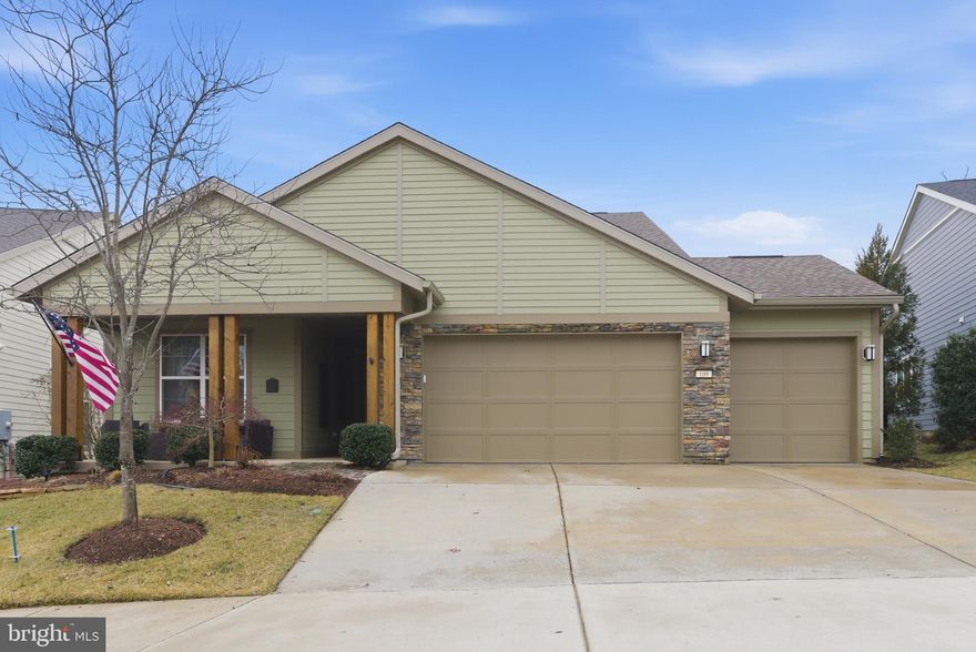 Experience luxury main-level living in Trilogy at Lake Frederick. This impeccably maintained home features elegant engineered wood flooring, 2x6 construction, and Hardie Plank siding with blown-in insulation for superior energy efficiency. The gourmet kitchen is a chef’s dream, boasting double wall ovens, a gas cooktop, and premium cabinetry, all flowing seamlessly into the dining and family rooms. A standout feature is the three-panel sliding door that opens the dining area to a covered porch with a gas fireplace, allowing for a true alfresco dining experience while overlooking a fenced backyard with great landscaping and wooded views under the pergola. The primary suite offers dual vanities and a frameless glass shower, while the den with French doors provides a flexible space for an office or extra bedroom.
This rare gem includes a spacious three-car garage and a maintenance-free lifestyle where the HOA handles lawn mowing, mulching, bush trimming, snow removal from the streets and sidewalks, and trash service. Living here grants you access to resort-style amenities including a golf simulator, fitness center, indoor and outdoor pools, tennis and pickleball courts, and a clubhouse featuring pool tables, pinball, shuffleboard, and a card room. Engage in the community’s vibrant social life through numerous clubs or explore your creativity in the arts and crafts room equipped with pottery wheels. The clubhouse boasts an award-winning restaurant Regions 117 and prestigious banquet hall, great for weddings and big events. This home perfectly blends high-end construction with an active, worry-free lifestyle.