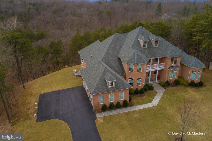 Stunning 8000 SF custom-built brick luxury home sited on 20 ac. 3 lots Very classy 5 br home w/ gorgeously finished common rooms.  Gourmet kitchen, granite,deluxe appliances. Magnificent LR w/ 20 ' ceiling, a wall of windows for mt. views Huge 1st fl MASTER SUITE. 3300 sf fin basement w/ media rm, Great room, gym Hundreds of sf balconies and decks. 8 mi to I-81, 75 min Dulles, 20 min MARC to DC