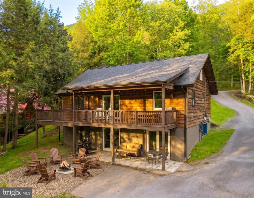 Lakefront home in the heart of Deep Creek Lake! Known as “WISPer Lake,” this established vacation rental offers 3 bedrooms and 3 baths with a warm mountain feel throughout. Features include wooded walls and timber framed ceilings, a wood-burning fireplace, spacious living areas, and a loft overlooking the main level. Enjoy 100' of private lakefront with Type A dock. Buydown included. Located just past Wisp, this property offers a McHenry location with less traffic on Marsh Hill Road which is a no outlet street, while still giving the convenience of being close to all things you need at the lake. The lower boast a spacious entertainment area, game room, and walks directly out to the outdoor fire pit and private path to the waters edge. Located just minutes from Wisp Resort, all restaurants, shops, and state parks. Great vacation home or investment opportunity. Call today to schedule a private tour!