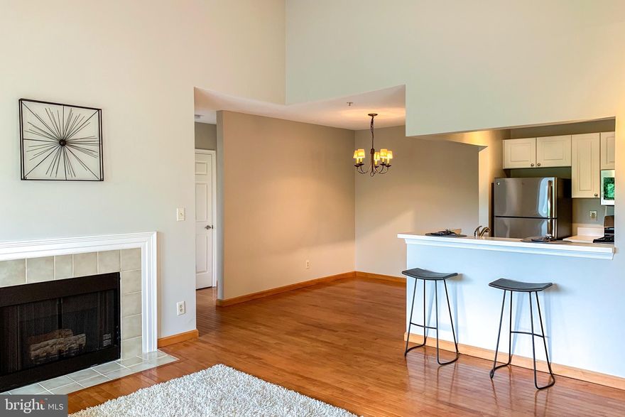 Offering Top Floor Unit in Ready,Move- in Condition. This bright, high vaulted ceiling condo offers a cozy fireplace, covered balcony, separate dining area with open floor plan that leads into a peninsula style kitchen that has brand new appliances, gas stove, built in microwave, new refrigerator to bring out your inner chef. Bathroom is spacious with an angled side by side full mirrored vanity, brand new floors and a tub to soak in after a hectic day. Den can serve as a study or extra bedroom. New Carpet and Kitchen Flooring with Freshly Painted Walls & Ceilings. HVAC <3 yrs old, Hot water heater is less than 1 yr old. Lots of great value and Condo association has healthy reserves and offers great amenities like outdoor pool, clubhouse and exercise room and grill/ picnic area that make for a great Stay-cation. Close to restaurants, University, Shopping, Airport, major roads and Hiways. Great opportunity to own in the up and coming One Loudoun Center. Come and see for yourself!