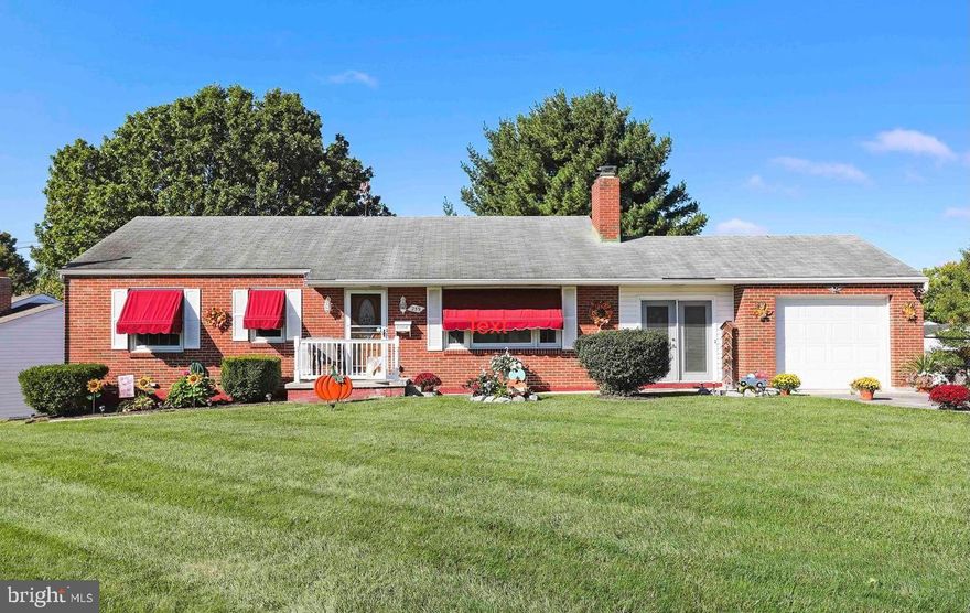 Welcome to this charming 3-bedroom, 1-bath brick rancher, perfectly positioned on a spacious corner lot. Step inside to find gleaming hardwood floors throughout and a cozy wood-burning fireplace that sets the tone for the inviting living room. The kitchen shines with granite countertops and brand-new Hess’s cabinets, while the partially finished basement offers additional living space, laundry area, and plenty of storage. Enjoy the convenience of a breezeway connecting the garage to the home, plus a backyard shed for even more storage. Recent updates include new awnings, new gutters, and windows with a lifetime warranty. The fenced-in backyard on a generous .33-acre lot provides privacy and space to relax. With a 5-year-old A/C unit, modern upgrades, and quick access to I-81 (3 minutes) and I-70 (7 minutes), you’ll love the balance of easy commuting and peaceful neighborhood living.