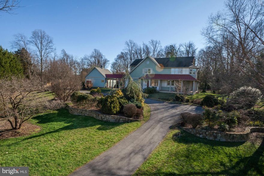 Tucked in an idyllic setting, this charming, 4,000+ SF colo w/an arts & craft, farm house feel, was designed by an architect, crafted by a top quality local bldr. Enjoy sunny interior incl. spacious MBR w/wood stove--perfect for winter mornings. In warmer temps, relax on the wrap-around porch, pool terrace, screened gazebo or sunroom w/3 sides of window. Gardener's paradise, spectacular plantings