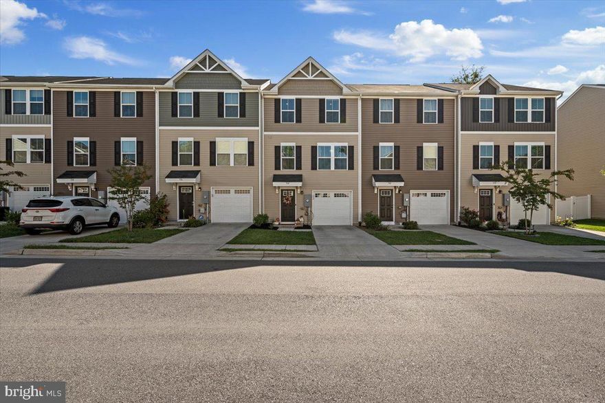 This Beautiful Home is a Breath of Fresh Air....Welcome to Townhome Living at it's very finest.  This 3 Level Home grabs you from the moment you step inside with it's modern appeal and sophisticated color scheme.  Enter at Garage Level into finished Foyer with gorgeous LVP....This space makes a statement and sets the tone for what's to come.  Move upstairs to arrive in the lightest, brightest Open Floor Plan;  Home to Kitchen, Dining and Living Spaces.   Main Level is the Hub of the Home with Gorgeous White Kitchen,  Stainless Appliances, Center Island, & Plenty of Cabinet Space, Counters and amply sized Dining Area.  Family Room connects with Kitchen and offers tons of space for your gathering and is complete with guest powder room.   Upstairs find Tastefully appointed Primary Suite with private Ensuite Bath and Walk-in Closet, Two additional Bedrooms, Hall Bath and Laundry Room.  No going up and down stairs for Laundry!   Storage galore is available in unfinished area of basement and 1 Car Garage.  Fenced Rear Yard offers privacy and security for pets. Come see for yourself.  This home is the total package.