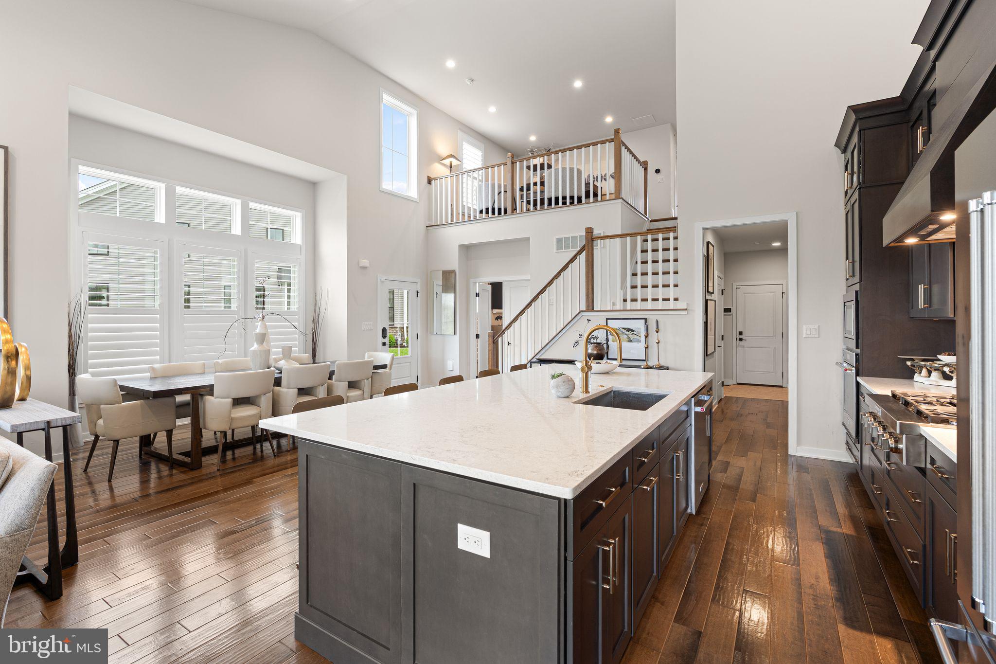 This Belliotti model located at the Reserve in Center Square was built in 2022. Almost brand new. The seller opted for many upgrades when designing this home. You will be stunned when you walk through the front door and see the depth and openness of the home. Seller had added two options that have extended the home. The back of the home is slightly longer than most giving you the added kitchen cabinets where the wine/coffee bar area is located and more living area. As well as the bump out at the dining room that extends further out giving you a more comfortable area to dine and space around to walk. Designed to perfection, the kitchen features soft close cabinets, a six-burner gas range, and extended island with quartz countertops. Throughout the home you will find speakers in every room that can be controlled via an app on your phone, plantation shutters, and a central vacuum system. Still on the main floor you have the gas fireplace, laundry past the kitchen as you walk towards the garage, and the primary ensuite. You enter the primary bedroom through the French doors, great size room, bathroom with walk in shower, and custom walk-in closet. The lot the home sits on is fairly private compared to others. There are no homes behind this one and you have access to the deck from the main floor or there is a walk out through the mainly finished basement. There is a loft area when you head up to the second floor where currently it has been designed for a home office, but it is a great space for additional living area, or kids space. Two more bedrooms upstairs and a third room that is a custom closet storage area. The second full bathroom is impeccably designed. Nothing cookie cutter about this home. Great location, right off Rte 73 between Blue Bell and Skippack. Great dining and shopping all around. Come check it out.