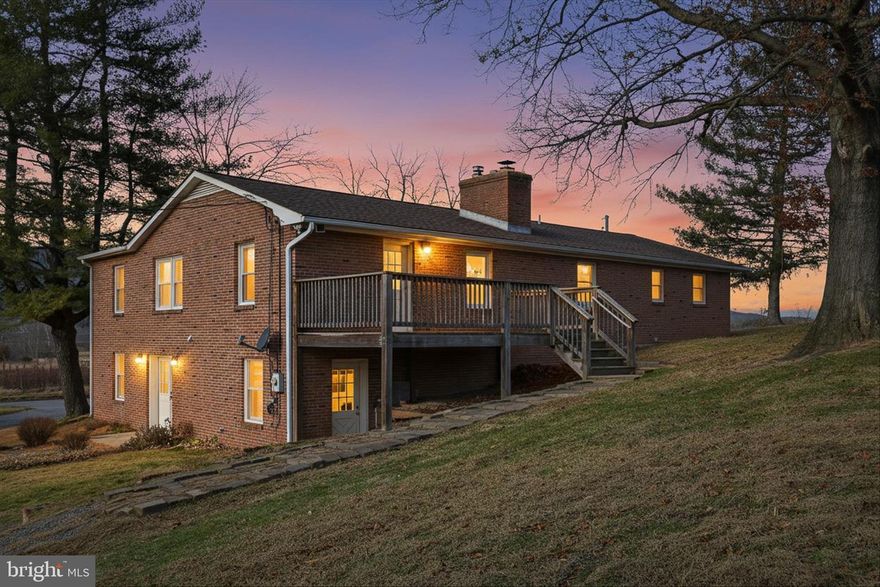 Brick Rancher with Guest Apartment & Scenic Country Views
Nestled in a peaceful country setting and surrounded by large tracts of  farmland, this spacious brick rancher offers privacy, open views, and timeless appeal. The well-proportioned single-level layout provides comfortable living with a seamless connection to the surrounding landscape.

A detached garage with a one-bedroom apartment offers exceptional flexibility—perfect for guests, multigenerational living, or a private retreat. Enjoy tranquil mornings, wide-open skies, and the sense of space that only a true rural setting can provide.

An ideal property for those seeking privacy, versatility, and classic construction in a serene countryside location.

CaCapon River access is close by.    The little town of Capon Bridge has plenty to offer.   The River House is a coffee and delightful lite fare with live music venue.  It also offers outdoor concerts in the summer,  community jams, arts and crafts for the kids, open mic night, poetry, etc...  The Farmer's Daughter which is a farm to table butcher who also offers amazing lunches, several locally run restaurants such as El Puente, Bent River Trading Post for local handcrafted wares, farmer's market in the summer.   Library, churches, post office, etc... The middle and elementary schools are located in Capon Bridge.