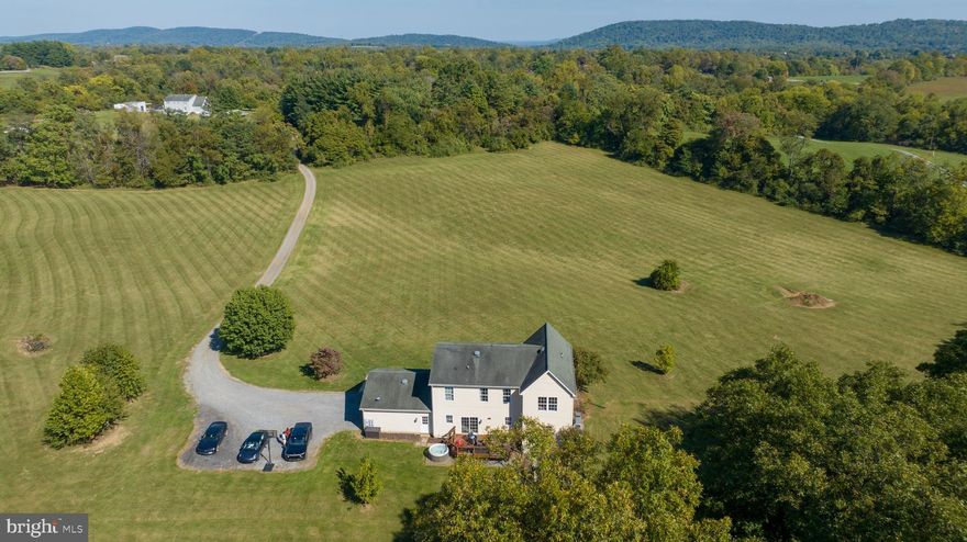 Introducing your dream retreat home! Nestled on 10 1⁄2 acres of pure serenity, this private oasis offers breathtaking views and endless opportunities for nature enthusiasts and aspiring farmette owners. Say goodbye to HOA restrictions as you embrace the freedom to raise chickens, horses, and more amidst the tranquil surroundings.

Stepping into this home you will appreciate all the upgrades and open floor plan.  The kitchen, a culinary haven, has been meticulously modernized with white cabinets, newer appliances, and a center island.  The kitchen seamlessly integrates the indoors with nature through a convenient sliding glass door leading out to the new deck.  

The living room has luxury vinyl plank flooring, crown molding, recessed lights, and a beautiful bay window. The spacious dining room is perfect for entertaining. Enjoy the ease of main-level laundry and knock off those dirty boots in the mudroom. 

Upstairs you’ll love the comfort of a generously sized master suite boasting a luxurious remodeled bathroom with a soaking tub and separate shower.  Organize your wardrobe in style in the large walk-in closet the hardwood shelving, drawers, and hanging rods. The second-floor living area provides the perfect area for work or play. There are also, two spacious bedrooms with large closets, and a fully updated bathroom on this level.

The walk-up basement presents an opportunity for personalization and is roughed in for a bathroom or wet bar.  Plenty of space for storage, a home gym, or a theatre room.

Park with ease in the oversized two-car garage, ensuring your vehicles and tools are accommodated effortlessly. To safeguard your furry companion, an invisible fence spans the property, providing peace of mind.  Outside you will enjoy the wide open spaces, and entertain on the back deck or under the gazebo.  A storage shed makes organizing your yard tools convenient. 

Say goodbye to high-town water prices with your own private well with a water softener and a three-stage water filtration system. The HVAC  has an air freshener system and house humidifier.

Don't miss this chance to claim your slice of Western Loudoun County's countryside—a rare gem that won't be available for long. Reach out now for more details and seize this exceptional living experience. Your paradise awaits!