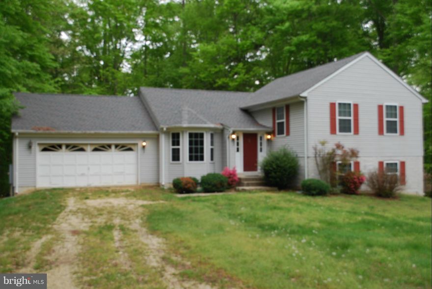 Your dream home on 5+ acres awaits you.  Natural light pours into this open floor plan with a great deck.  Very quiet location on a lovely cul-de-sac.  Convenient to Patuxent River, Waldorf, Dahlgren and Washington D.C. Perfect for entertaining!