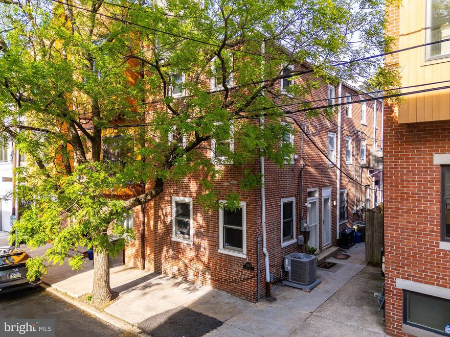 Welcome to 1003 N. Orianna Street #A—a beautifully updated 2-bedroom, 1-bath corner trinity tucked along a serene, tree-lined block in the heart of Northern Liberties. As a corner home with southern and western exposures on every level, this residence is drenched in natural light and enjoys exceptional airflow throughout, creating a bright and uplifting atmosphere in every room.
Full of charm and thoughtfully renovated, this classic trinity showcases original hardwood floors, exposed brick walls on all three levels, wood accents, and beautiful architectural detail. The open and inviting first floor features custom built-in shelving and a newly exposed brick fireplace, revealed by removing part of a wall to bring added warmth and character to the space. The lower-level kitchen has been completely remodeled, featuring stylish new flooring, custom cabinetry, subway tile backsplash, a 2024 Summit stove, Frigidaire refrigerator, garbage disposal, upgraded sink and faucet, and a Samsung washer and dryer set from 2025—all designed to balance functionality with modern style.
On the second floor, you'll find a bright and versatile bedroom or home office with built-in shelving and an exposed ceiling, along with a modern tiled bathroom. The primary bedroom on the third floor is a tranquil retreat, enhanced by dual exposures, exposed brick, and hardwood flooring, offering an airy, peaceful place to unwind.
This home also features a brand-new HVAC system installed in 2025, refinished hardwood floors throughout, stairwell bannisters, dual-roller privacy shades on the first floor, a roof that was resealed in 2021 and serviced again in 2024, and a sealed chimney exhaust. The result is a move-in-ready home that has been lovingly maintained and smartly updated for today’s lifestyle.
In close proximity to Liberties Walk, Liberty Lands Park, and Orianna Hill Dog Park, and surrounded by some of the city’s favorite destinations—like Menagerie Coffee, Kettle Black Bakery, Hello Vietnam, Suya Suya, Pizzeria Beddia, Middle Child Clubhouse, and Penn Treaty Park—this special home combines the best of neighborhood charm, convenience, and character.
Don’t miss this opportunity to own a stylish, sun-soaked corner trinity in one of Philadelphia’s most vibrant neighborhoods.