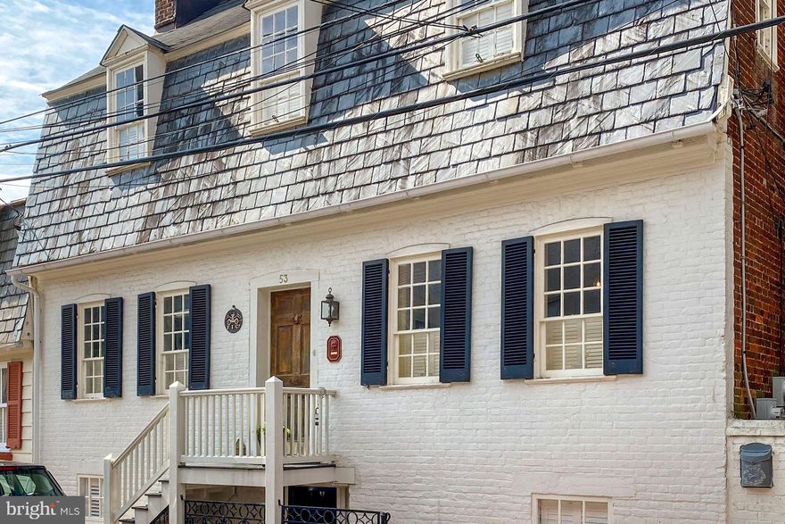 Two extraordinary houses! A stunning, restored main residence and renovated 2 bedroom Cottage/guest house with rental license (rents for $3600 per month). One of the 10 oldest private residences in Annapolis, this restoration preserves its integrity while adding every modern convenience.  Gorgeous cook's kitchen with large pantry, stainless and lovely granite, marble baths, excellent systems and two working wood burning fireplaces.  Center hall features the original staircase and is flanked by large double parlors each with original fireplace mantels, wide board pine floors and 9 ft ceilings. Incredible patina throughout. Recently renovated Cottage with open floor plan, great rooms with cathedral ceiling, newer kitchen, with breakfast bar and bath, separate systems, metal roof and an excellent rental history.  Cottage can be rented or is just perfect for in-laws and/or an in-home office. Main house lower level has ensuite bedroom, laundry, great storage and separate exterior entrance.  Lovely ornamental ironwork detail throughout. The perfect brick terrace for entertaining or relaxing! Two blocks to the City Dock!