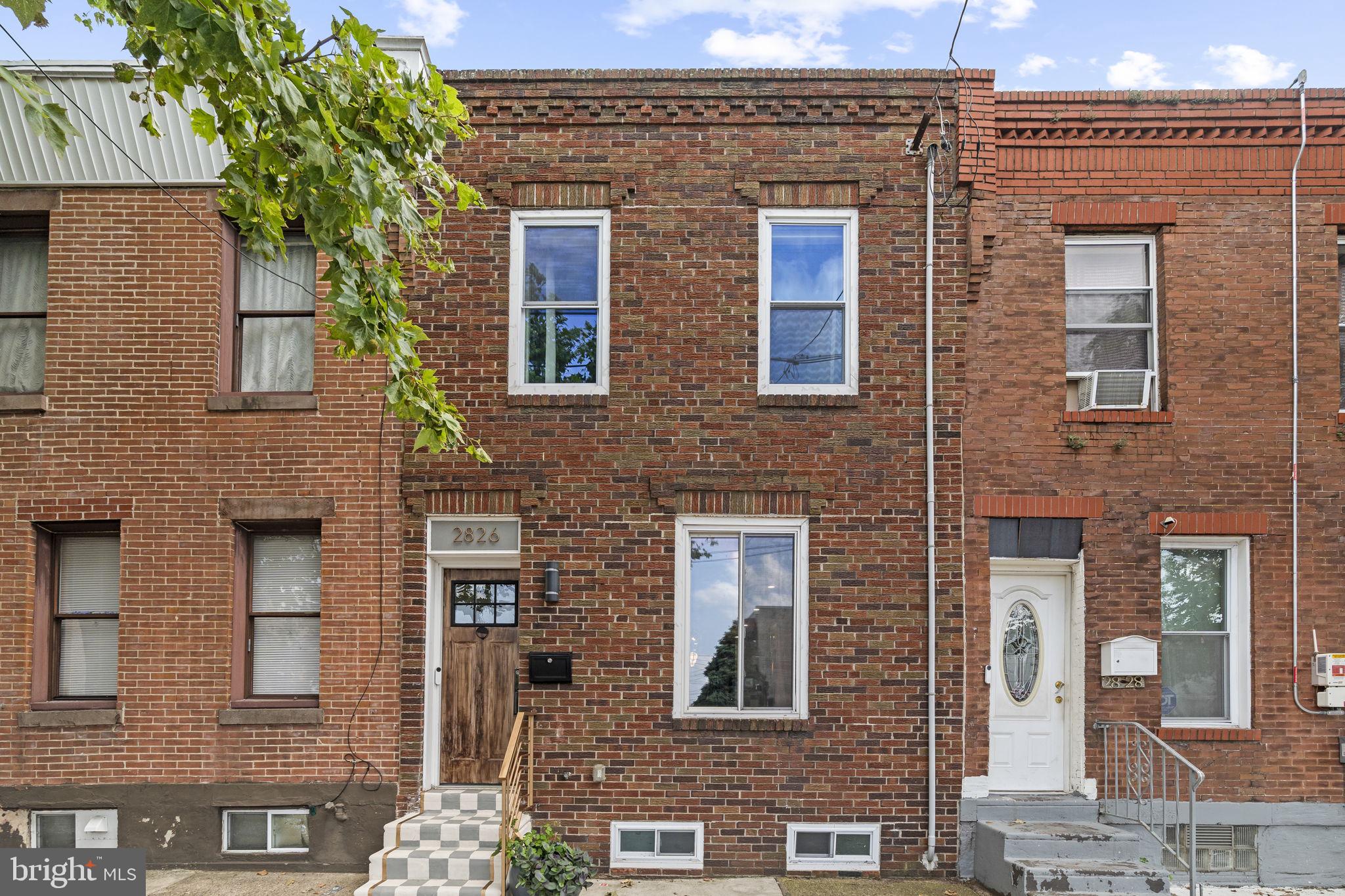 This isn't your average South Philly rowhome! Step into a beautifully renovated home where charm meets elegant design and finishes on a peaceful, tree-lined street. This spacious 3-bed, 2.5-bath sanctuary, meticulously updated is ready for a new owner to move right in and unpack. The main level is a masterclass in flexible living. The curated front room, currently used as a dining area, complete with sleek built-in storage, flows into a central, state-of-the-art kitchen. Here, you'll find elegant quartz countertops, high-end stainless steel appliances, and a stunning center island with a waterfall edge. A designer powder room adds a touch of sophistication behind the cozy living room area, while the large patio out back offers a seamless transition for indoor-outdoor living and entertaining. Upstairs, the primary suite is a true retreat. It features dual closets and an attached full bath with a glass enclosed shower, creating a spa-like feel. This floor also includes two additional bedrooms and a cleverly designed office space, along with a stylishly tiled hall bath. The finished basement is an entertainer's dream, featuring modern tile flooring and a dry bar with a wine fridge. A separate finished laundry area provides extra storage and convenience. Last but not least, that this home also comes equipped with solar panels for energy efficiency (currently leased). This home offers the best of both worlds- tree-lined living with quick access to the city's pulse, just minutes from the airport, I-76, and the vibrant restaurants and bars across various neighborhoods.