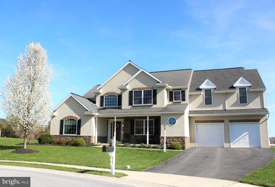 Fabulous Manheim Twp. home with open floor plan and tons of natural light. Kitchen with maple cabinets, tile backsplash and granite counter tops. Large 2-tier island. Stylish master suite includes state of the art bathroom with double vanity, whirlpool, double head walk in tile shower. The many extras include hardwood flooring, interior guest suite and French doors. Play set on the lot is negotiable.