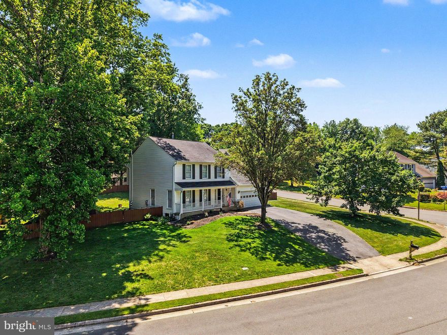 Beautifully updated and move-in ready in sought-after South Run Oaks, this Fairfax Station home is tucked away on a quiet double cul-de-sac with no thru traffic and sits on over a third of an acre with a fully fenced flat backyard. From the welcoming front porch to the TREX deck, updated white kitchen, rich hardwood floors, and spacious finished basement, this home offers the perfect combination of comfort, updates, and location.

Step inside and immediately notice the beautiful dark hardwood floors flowing throughout much of the home. The fully renovated white kitchen features tall cabinetry, an island, pantry, stainless steel appliances, and a sunny breakfast area overlooking the backyard. Just off the kitchen is the oversized family room with a gas fireplace and two sliding glass doors leading directly to the deck, creating a great flow for everyday living and entertaining. Separate living and dining spaces at the front of the home offer additional flexibility and natural light throughout.

Upstairs are 4 spacious bedrooms, including a large primary suite with a spa-like renovated bathroom featuring dual vanities, a soaking tub, oversized shower, slate flooring, and a built-in wall safe. The hall bathroom has also been updated with newer finishes and vanity. One secondary bedroom is especially large and would make an ideal office, playroom, or flex space.

The fully finished lower level offers even more living space with a large recreation room, bonus room/office, half bathroom, and an oversized laundry room with extensive cabinetry and extra storage space.

Major updates include the roof (2015), HVAC (2017), and hot water heater (2019). Located in the highly desirable South Run Oaks neighborhood, residents enjoy easy access to trails leading to Lake Mercer and Burke Lake Park, nearby soccer fields, basketball courts, playgrounds, and optional community pool memberships. Zoned for Silverbrook Elementary and South County High School pyramid schools and conveniently located near Route 123, Fairfax County Parkway, commuter lots, Metro access, Fort Belvoir, and the The Pentagon.