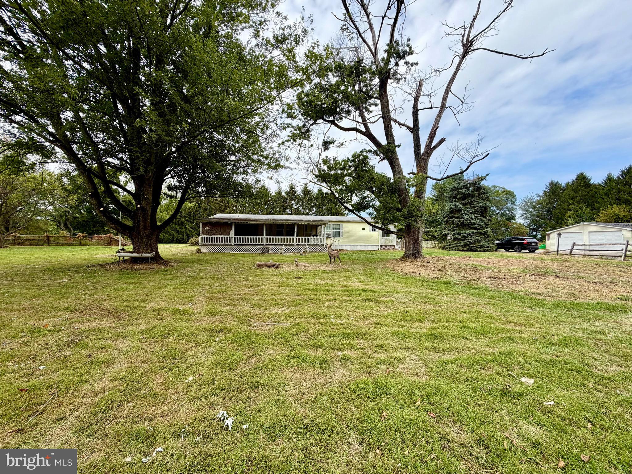 Spring Grove schools, country setting, flat 1.82 acre lot with lots of potential! This lot features a double wide manufactured home, an oversized detached two car garage, and numerous sheds. The home boasts three bedrooms, two full bathrooms, a large living room with a fireplace, a dining room, kitchen, and a large covered porch. Schedule your showing today!