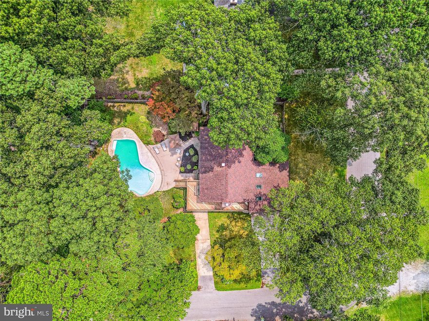 Get ready for your summers of fun! Riverdale contemporary home with HUGE oversized double garage,  HEATED  Gunite saltwater pool and great backyard space* Great community for walks around the block and to community waterfront park* Minutes by car to Magothy Gateway Shopping Center with Harris Teeter and commuter access routes* Some water views of the Magothy River from wrap around deck overlooking fully fenced backyard and dining room *Hardwood floors on upper level living areas and bedrooms with brand new luxury vinyl plank floors on ground level* Brand new carpet on Stairs and loft over garage with skylights and flex space for play or work* Main level entrance bedroom and full main level bathroom with small kitchenette  for multi generational living space* Inground pool is surrounded by lots of entertainment & patio areas for barbequing and pool parties* Pool is 9' 5" deep to 4' shallow with 3 speed variable pump (2022) and  new heater (2019 *House has been meticulously maintained and has 4 brand new sliding glass doors give lots of light to both levels along with vinyl updated windows (2007) *When winter comes enjoy your wood burning fireplace and enormous recreation/game room and room for workshop space in the garage*Owners suite has large 13' x 10' sitting room that can be converted back into 4th bedroom* Other updates Roof (2014) , washer (2020), dryer (2021) and all of the systems have been updated by current owner. This is a wonderful opportunity and space with Severna Park address*