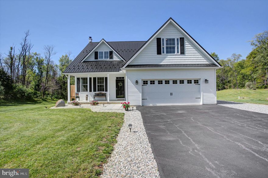 Discover a beautiful, well-maintained home in the country on 2.5 acres in a rural setting that perfectly blends modern comfort with versatile outbuildings and an outdoor lifestyle.  Located in the desirable Warrington Township within the Northern York School District. This unique property features a classic bank barn and corn crib—both thoughtfully remodeled into exceptional spaces—ideal for car collectors, artists, or anyone needing room for equipment, toys, or creative pursuits. The detached 50x24 shop with concrete floors, electric, built-ins, and overhead door provides space for 4+ vehicles plus workshop area, making this property a rare find for those seeking a home with additional space.  Built in 2019, the home feels nearly new and offers the ease of main-level living with a spacious primary suite and private bath featuring a fully tiled walk-in shower with river rock flooring. The main level also includes a convenient laundry room and 9-foot ceilings, while the living room impresses with soaring ceilings, abundant natural light, and a gas fireplace. The open layout flows into a custom kitchen with maple cabinetry, granite countertops, a center island with bar seating, and ample space for a large dining table, with sliding doors leading to an expansive rear deck. Upstairs, you’ll find two additional bedrooms plus a large bonus room over the garage that can serve as a fourth bedroom, recreation room, or hobby space. The full walk-out basement offers even more flexibility with a Fisher wood stove, storage space, home gym potential, and rough-in plumbing for a future bathroom. A unique touch includes decorative tin ceiling panels reclaimed from the original barn.  Outside, the deck offers peaceful country views, complete with a hot tub and a remote-retractable Sunsetter awning—perfect for relaxing or entertaining.  The backyard provides plenty of room for recreation, gardening, and entertaining, featuring a large firepit area, utility shed, and even trails for dirt bikes or ATVs. Wildlife is abundant, offering frequent deer sightings and a true connection to nature.  The property is served by a sand mound septic system, two wells (primary drilled well plus a secondary shallow stone well for use at the barn), and 400-amp electric service. This property is well-equipped to support a variety of lifestyles.
Conveniently located just minutes from Gifford Pinchot State Park for hiking, boating, fishing, kayaking, and swimming, and close to Roundtop Mountain Resort for skiing and year-round recreation, this exceptional property offers the perfect balance of rural tranquility and access to outdoor adventure. A rare opportunity to own a move-in-ready home with acreage, outbuildings, and endless possibilities in Northern York County.   The current owners love this property; however, they are retiring and moving south.