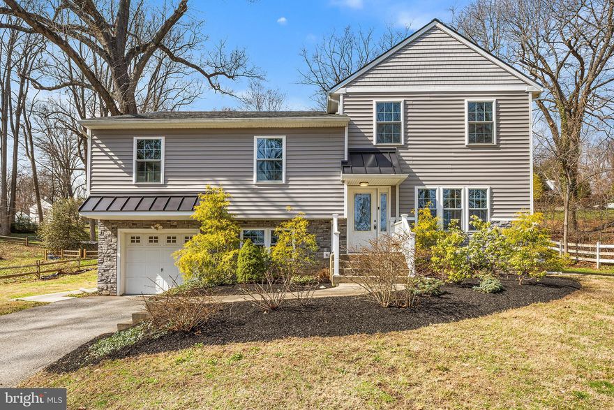 Beautifully renovated and expanded 4-bedroom, 2.5-bath home in the award-winning Tredyffrin-Easttown School District, set on a spacious lot in a highly desirable Berwyn/Paoli location. The main level features hand-scraped hardwood floors and bright, open living spaces. The oversized gourmet kitchen includes a large island, custom soft-close cabinetry, granite countertops, tile backsplash, Samsung stainless steel appliances, and a pantry. The kitchen flows into a stunning family room with vaulted ceilings, four skylights, abundant windows, and a propane fireplace—an ideal space for relaxing or entertaining. A bluestone patio just off the family room overlooks the expansive backyard. Upstairs are three generously sized bedrooms and a beautifully updated hall bath. The upper level is dedicated to an impressive primary suite with a sitting area, large walk-in closet, and spa-like bath with oversized walk-in shower and double vanity. The lower level provides flexible space for a home office, playroom, or den, plus a powder room and laundry area. Major upgrades include newer roof, windows, siding, driveway, and propane-fired HVAC with central air. Conveniently located across from the Upper Main Line YMCA and close to shopping, dining, regional rail, and major commuter routes including 252, 30, 202, 76, 476, and the PA Turnpike.