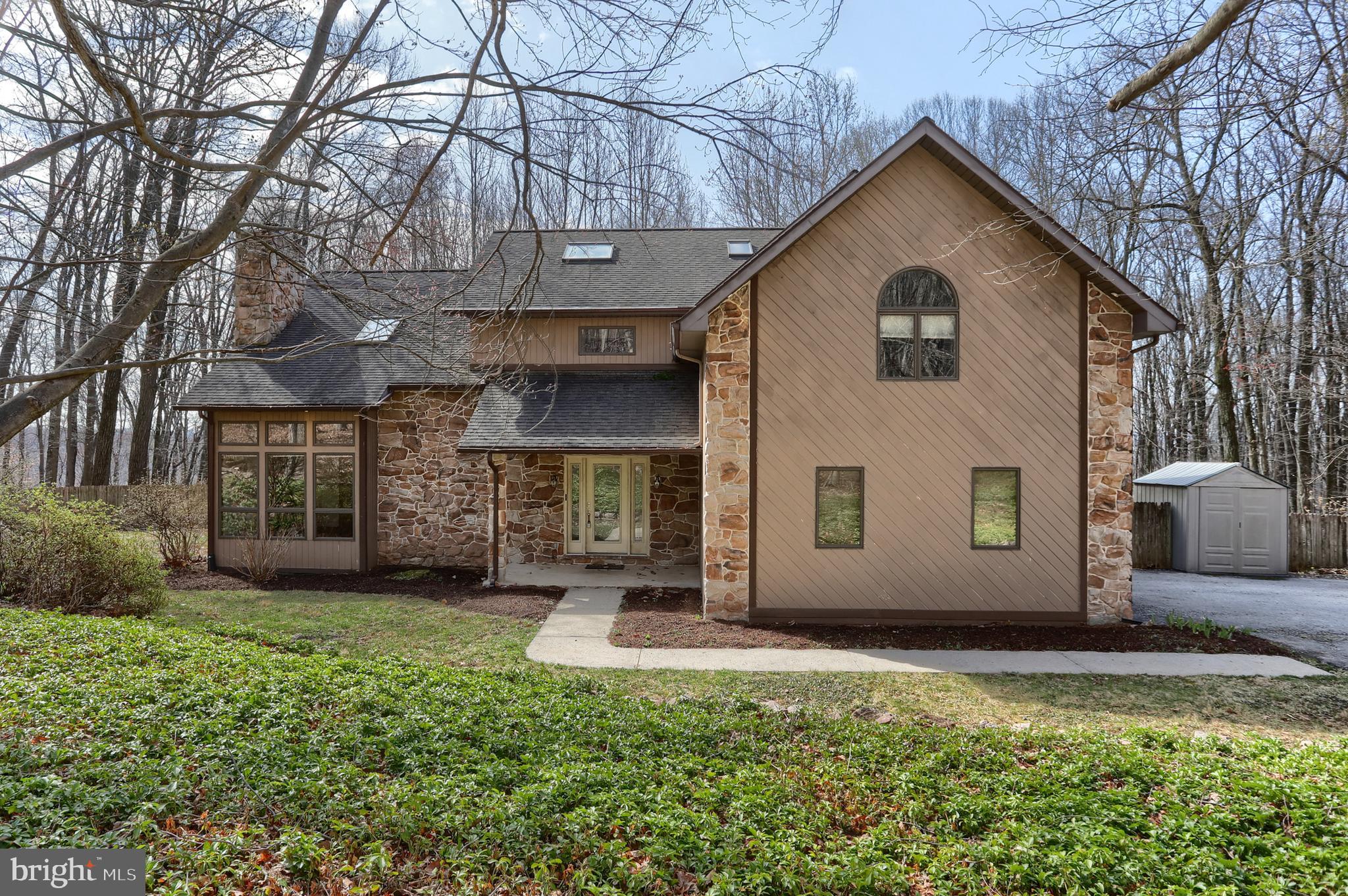 ** Offer Deadline Set - Monday 4/7/25 @ 4pm ** Tucked away on 4 private acres, this serene home offers privacy and tranquility in the woods of Spring Hill Acres. The two-story living room features a cozy fireplace, while the eat-in kitchen sits between the kitchen and family room, creating a warm gathering space.
The home boasts three oversized bedrooms, including a primary suite with an attached finished bonus room above the garage, perfect for an office or den. The finished walk-out basement with a full bath adds flexible living space. Enjoy the fenced-in yard and peaceful surroundings. A true woodland escape, yet conveniently located. Schedule your private showing today!