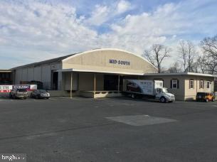 34,000 sf warehouse with current tenant in place. Building is leased through January 30, 2018 with a NOI of $150,000. Building includes 3 drive-in doors and 2 loading docks. Offices and showcase room located at front of building. Covered dock large overhang on left side of building provide additional storage.