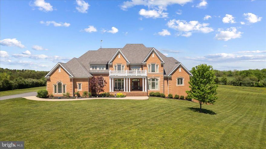 This exquisite custom home sits on over 20 acres of fenced rolling hills and overlooks a private 12-acre lake and adjacent horse property.  The lake is owned approx. 1/3 by this property owner and approx. 2/3 by the adjacent land owner.  The views are spectacular and the setting is breathtaking.  You’ll feel like you’re on vacation every single day.  There’s also plenty of space to add a pool if you desire.  This property offers endless entertainment - outdoor volleyball or basketball court, fishing or swimming from your private dock, watching movies in your theatre room and more.  

The interior exudes elegance and has every detail covered.  Enter the spacious 2-story foyer with a custom wood-paneled ceiling.  You’ll enjoy the elegance of the Brazilian Cherry Hardwood floors throughout the main floor.   The home's gourmet kitchen is the perfect canvas for gathering family and friends and creating epic meals. The kitchen's main star is the built-in Viking gas stove which is accented by a gorgeous brick surround. The adjacent breakfast nook features a beautiful tray ceiling and leads the way to the large family room, featuring a stone fireplace and french doors that lead out to the back porch.  With 6 bedrooms, 6 bathrooms, and 2 - 1/2 baths, your home will accommodate as many family or friends as you choose! The primary suite is on the main level with  a spa like bathroom, equipped with a substantial shower that includes a steam option. There is also a 2nd bedroom and private bathroom on the main floor.   The 2nd story has a large, open TV/study/play room, flanked by 4 large additional bedrooms.  The substantial basement is fully finished with a theatre room, full gym, batting lane, plenty of space for a pool table and ping pong tables, and seating area around the fireplace.  Enjoy the full basement bathroom after a great workout!  There is also a walk-in wine bar in the basement.  

You really need to see this property to fully experience it and appreciate it.  This combination of features is so rare and convenient to both NOVA and the Shenandoah Valley area.  Please plan ahead as there is a 24 hour notice required to view the property.  Please do not pet or feed the horses as they belong to the neighbor.  PLEASE - NO DRIVE BYS!